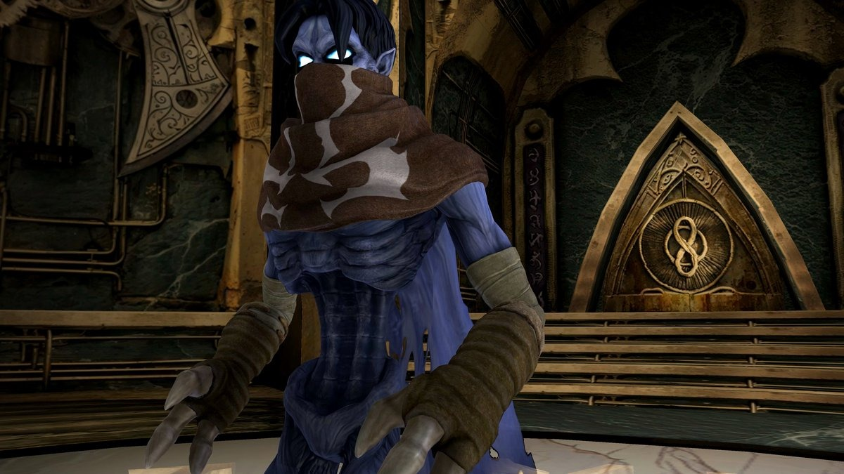 Een blauwhuidig personage met een bruine sjaal en een masker in een stenen kamer.