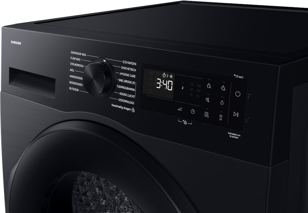 Close-up of a black dryer's control panel, displaying a digital clock and settings.