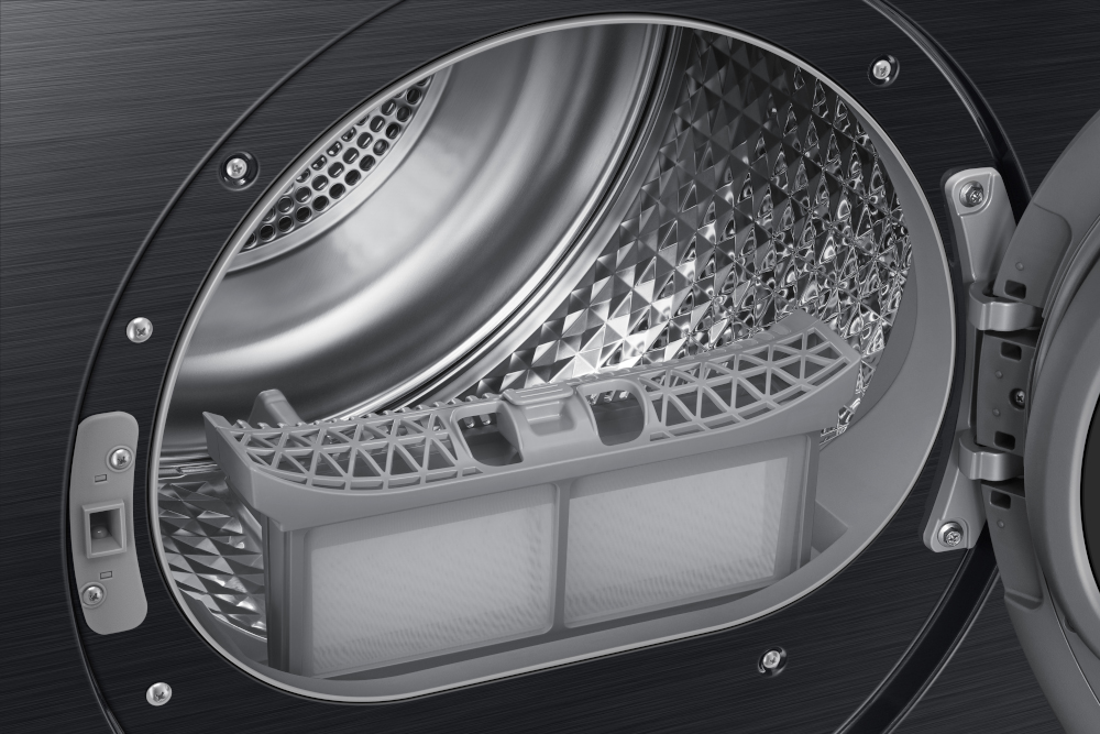 Inside of a black dryer, showing the filter. The interior is silver and metallic.