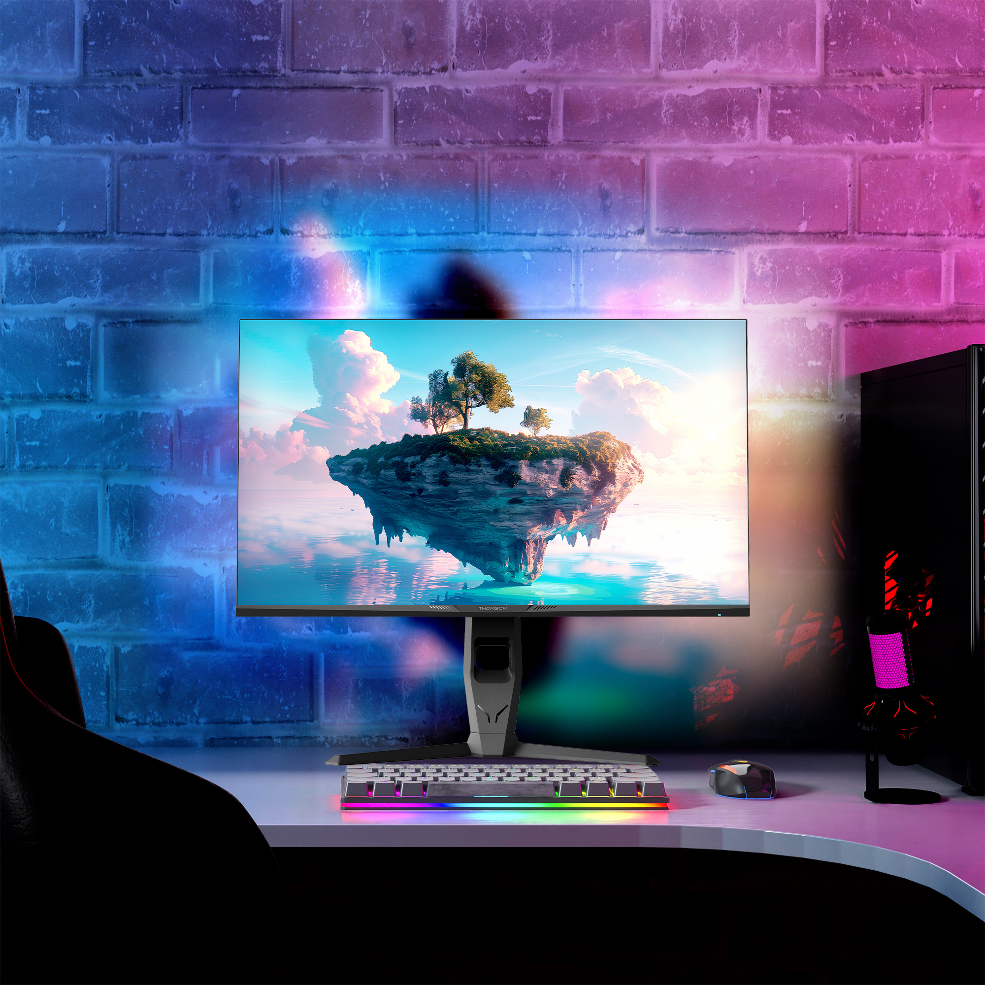 Egy gamer setup, monitorral, szigetet ábrázolva, billentyűzettel és PC-vel.