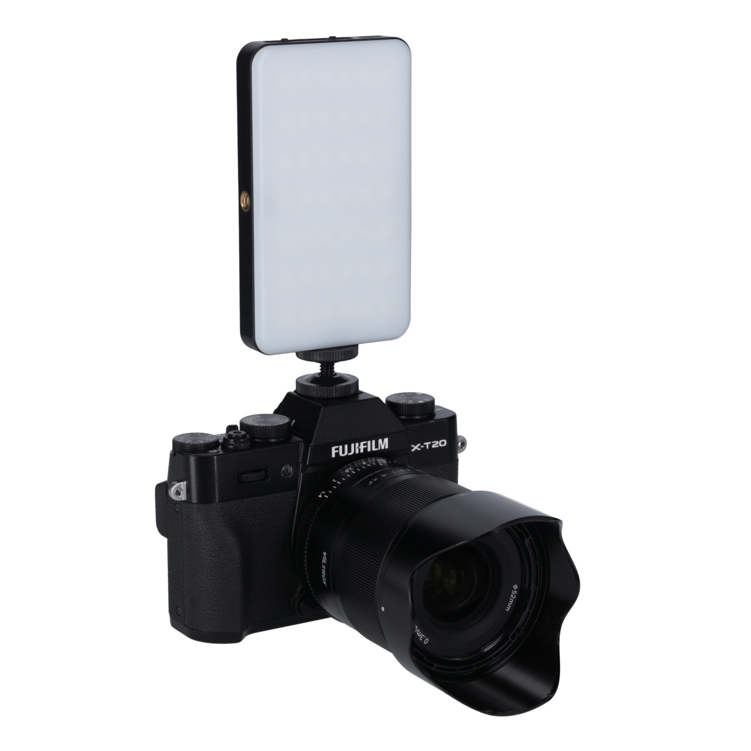 Black Fujifilm X-T20 camera with a lens and attached LED light, on a white background.