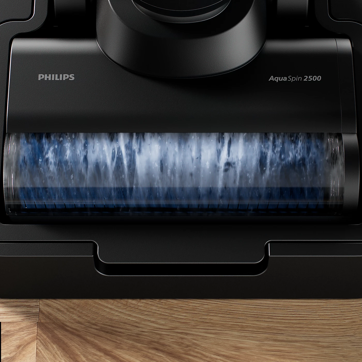 Gros plan sur la tête d'aspirateur noire avec le logo Philips et l'étiquette Aqua Spin 2500.