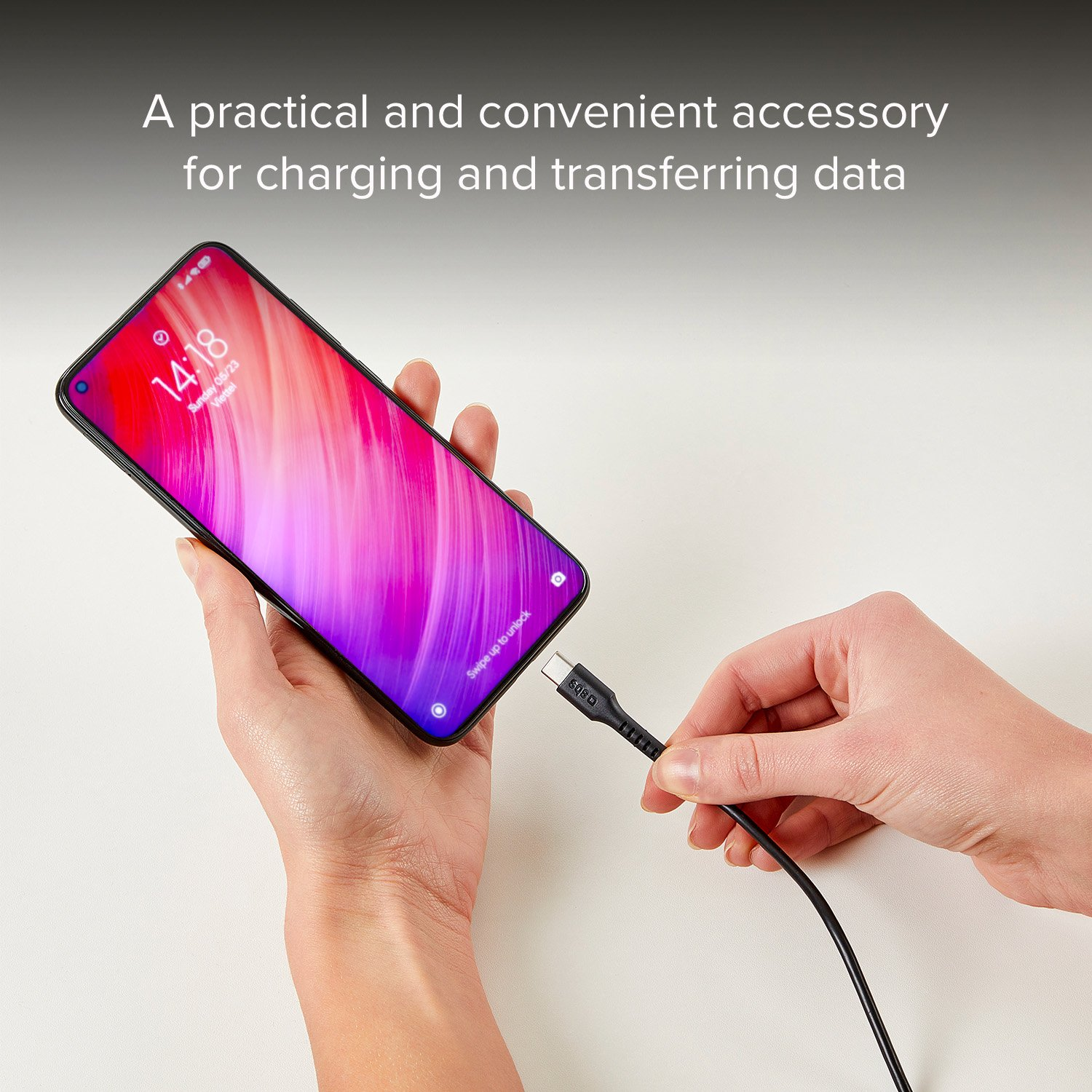 Hands holding a phone and a USB-C cable, charging the phone. Text: charging and transferring data.