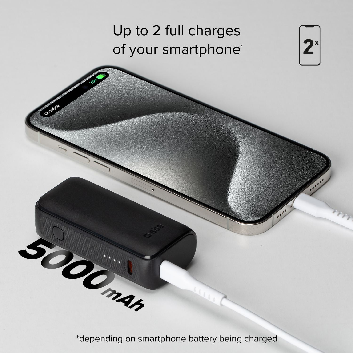A black power bank charging a phone, with text on a white background.