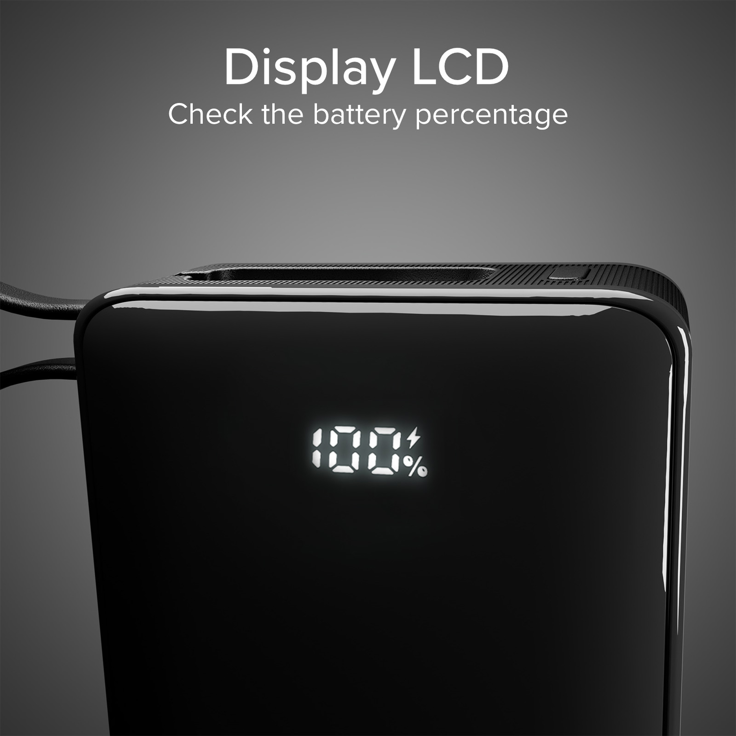 Black power bank with a white display showing 100% battery, dark background.