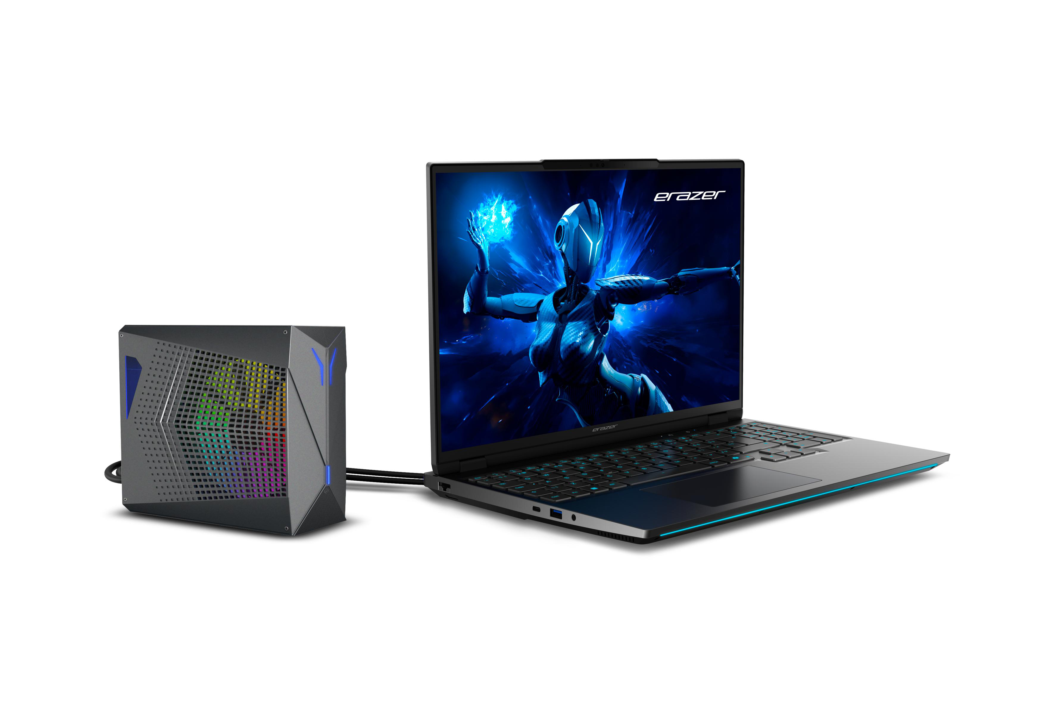 Ein Laptop mit einem Videospielbildschirm ist mit einem schwarzen Gerät verbunden.
