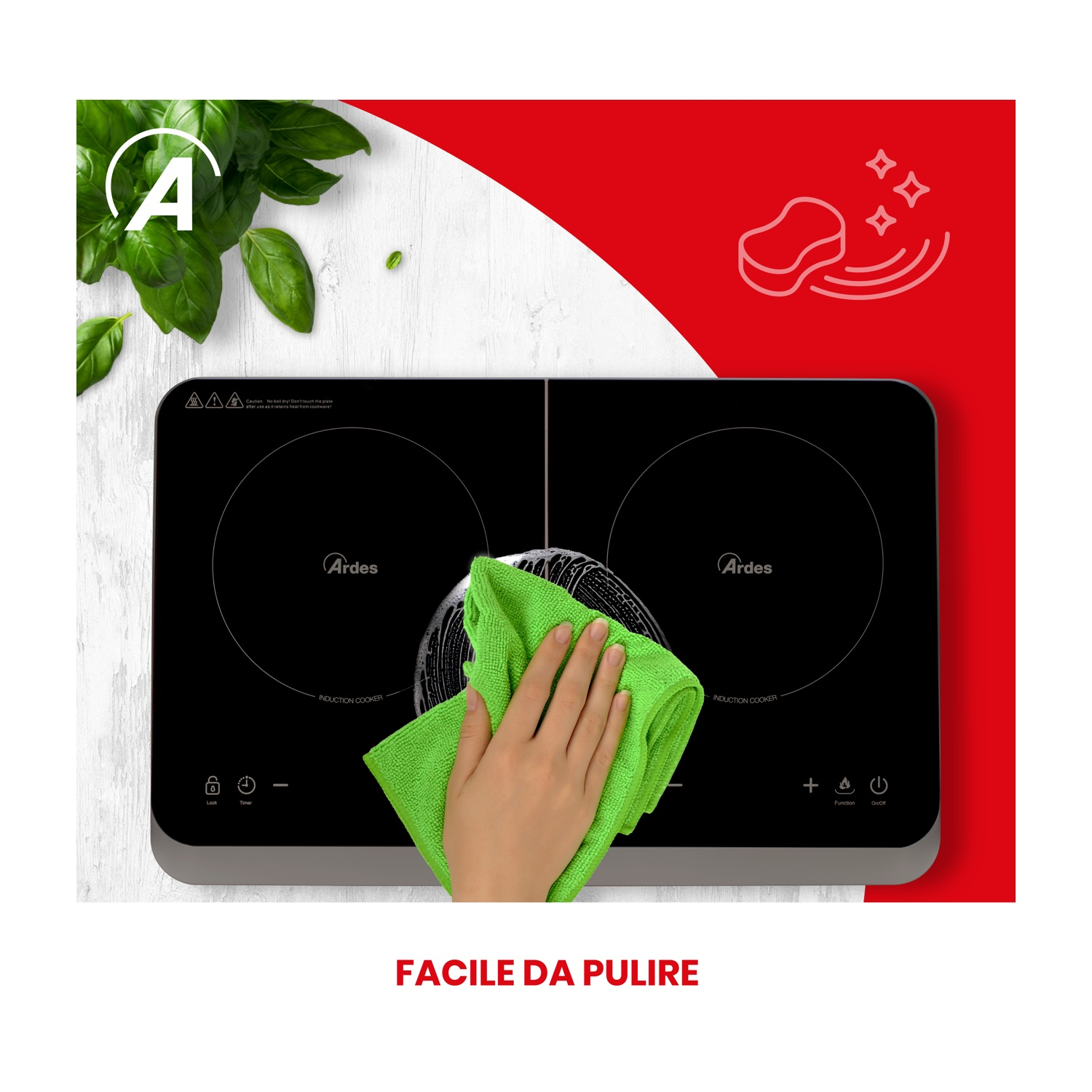 Una persona pulisce un piano cottura a induzione nero con un panno verde, design rosso e bianco.