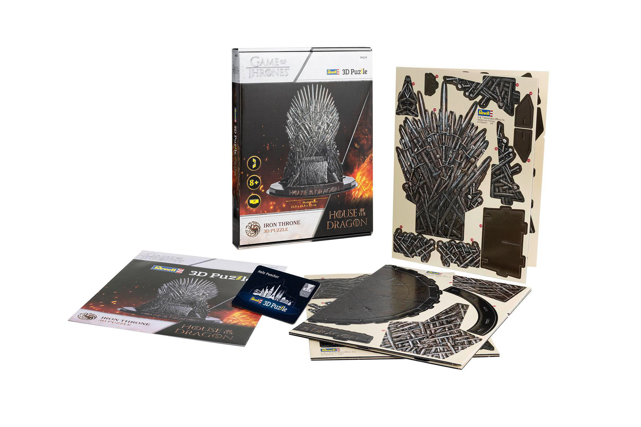 Eine 3D-Puzzle-Box von Game of Thrones mit Puzzleteilen und Anleitungen drumherum.