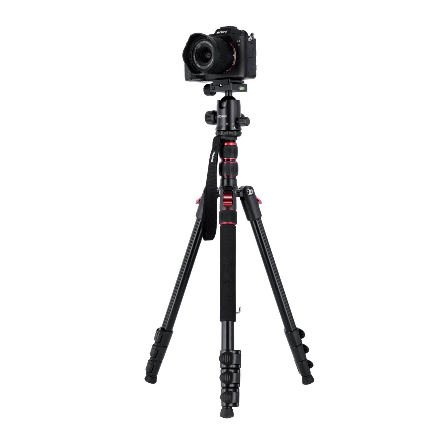 A camera mounted on a tripod, set against a black background.