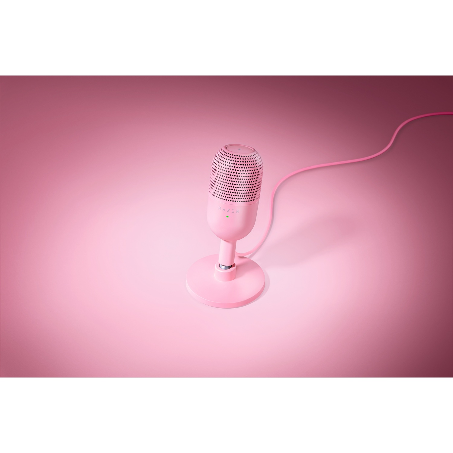 Pink Razer microphone on a stand, pink background.