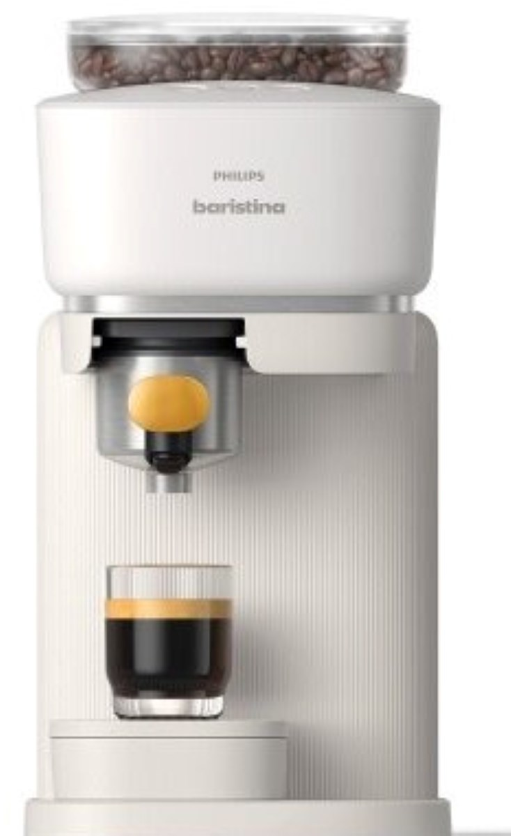 Biały ekspres do kawy Philips Baristina ze szklanką espresso.