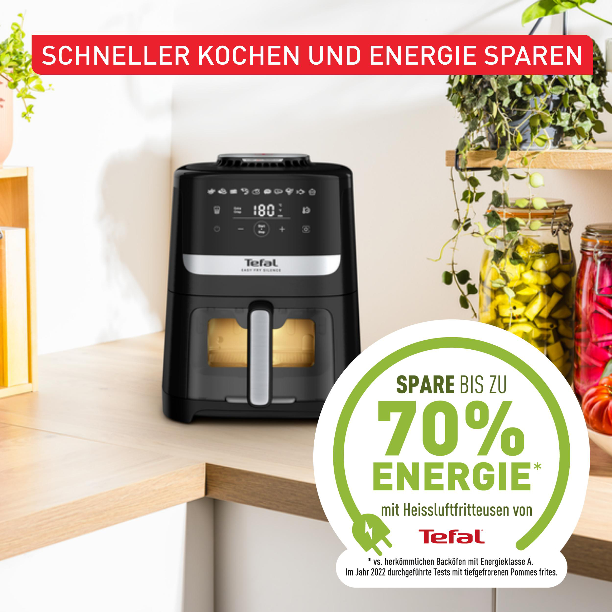 Schwarze Heißluftfritteuse mit Display, Text: „Sparen Sie bis zu 70 % Energie“.
