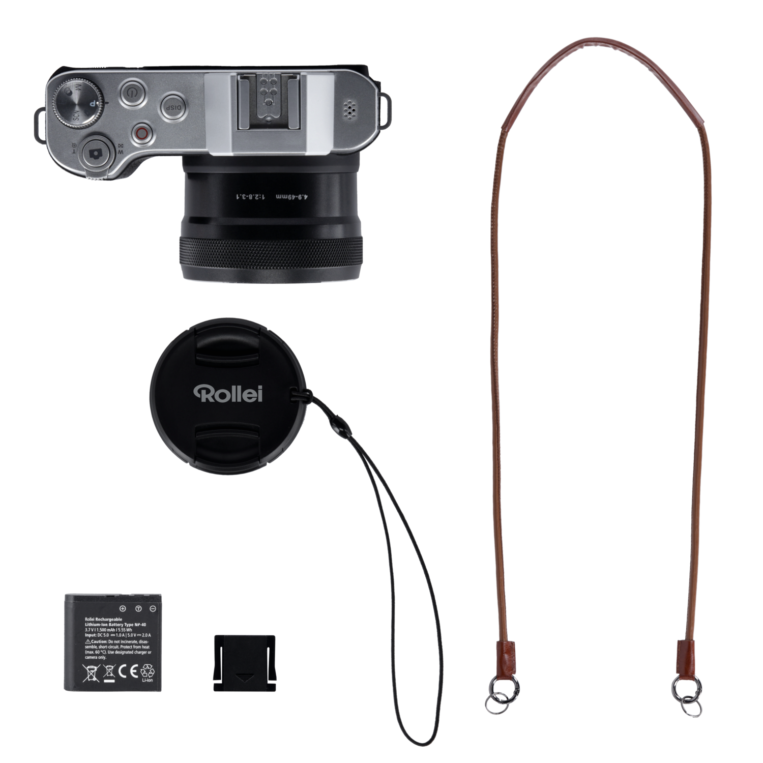Appareil photo, bouchon d'objectif, sangle, batterie et chargeur sur surface noire. Tout organisé.