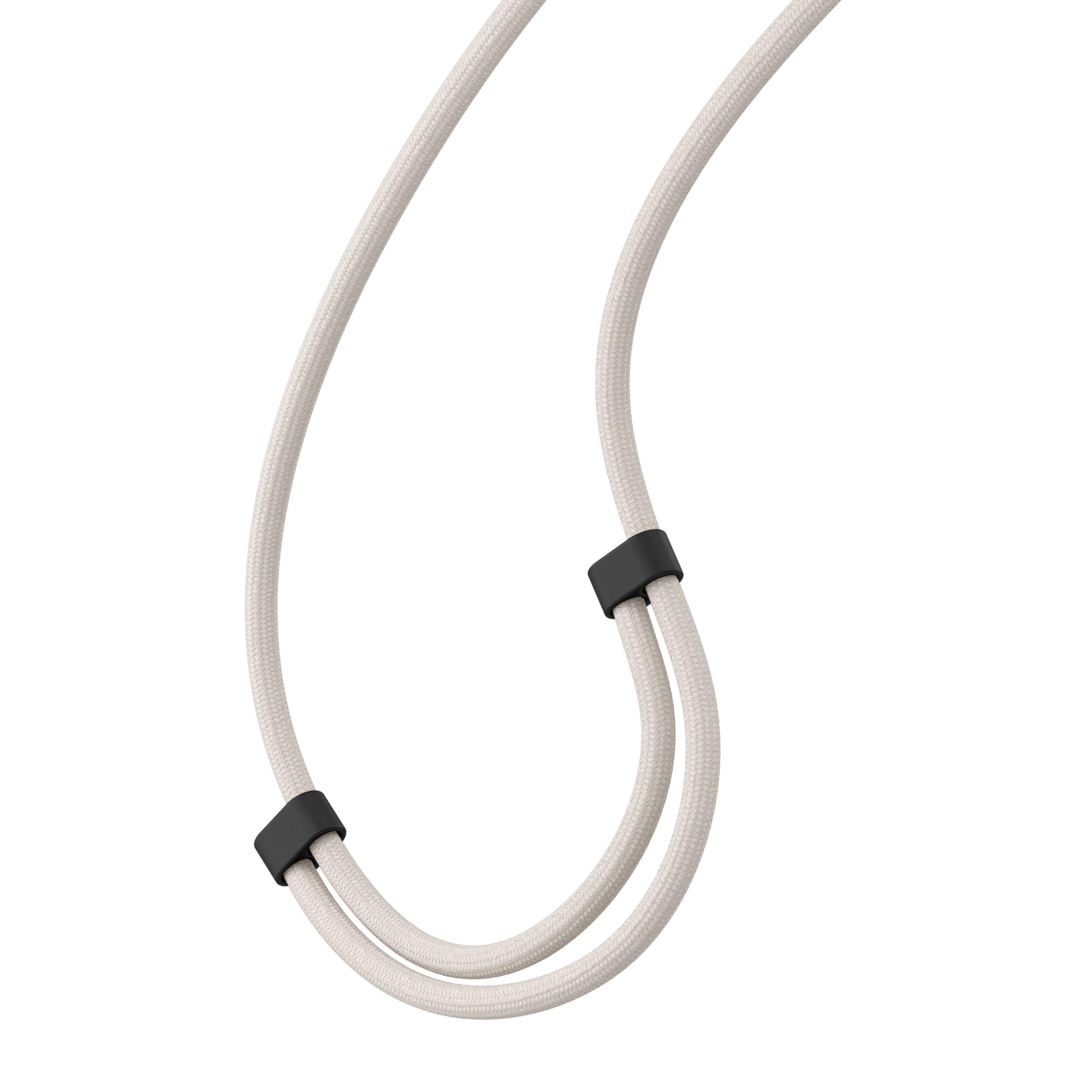 Ein weißes Kabel mit zwei schwarzen Gummiringen. Einfache Nahaufnahme.