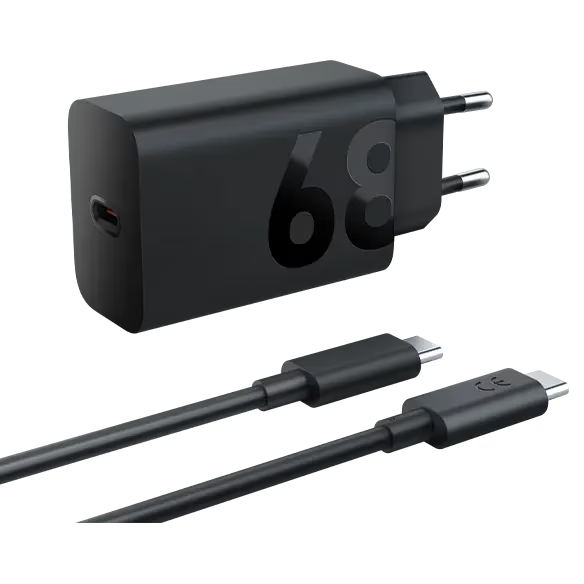 Cargador negro de 65W con dos cables USB-C negros, sobre fondo negro.