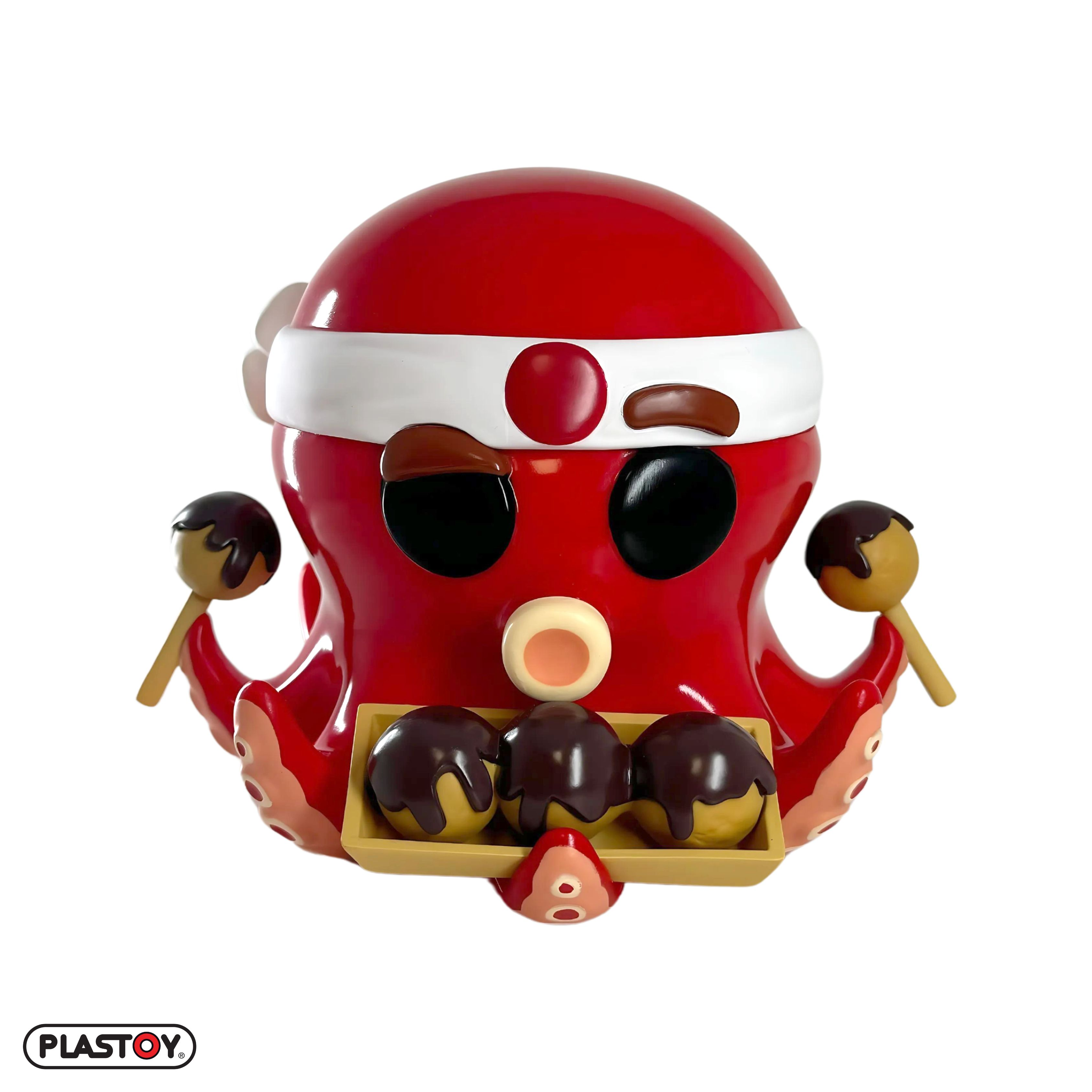 Rote Oktopus-Kochfigur mit Takoyaki, vor weißem Hintergrund.