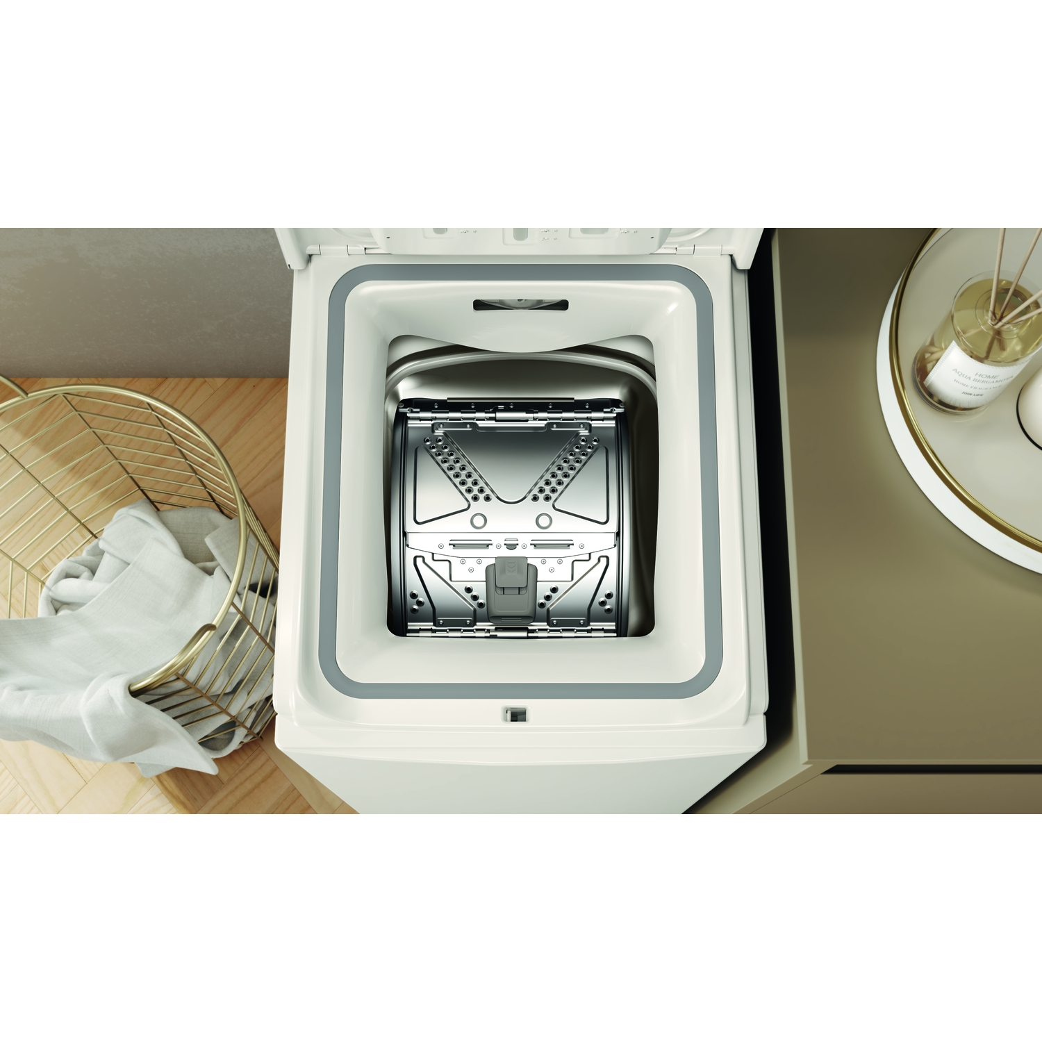 A washing machine with the lid open.  A gold basket and other items are visible.