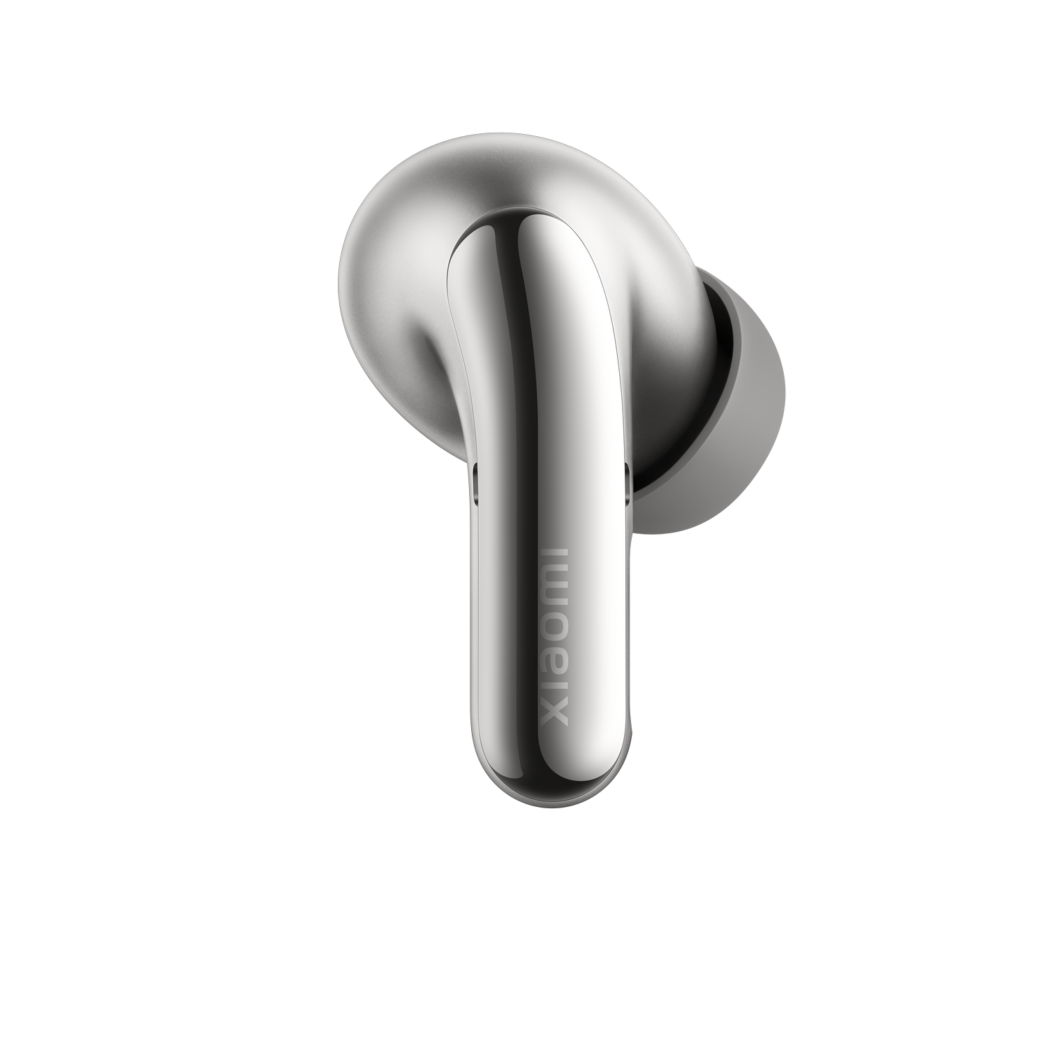 Un auricular inalámbrico plateado con superficie brillante sobre un fondo negro.