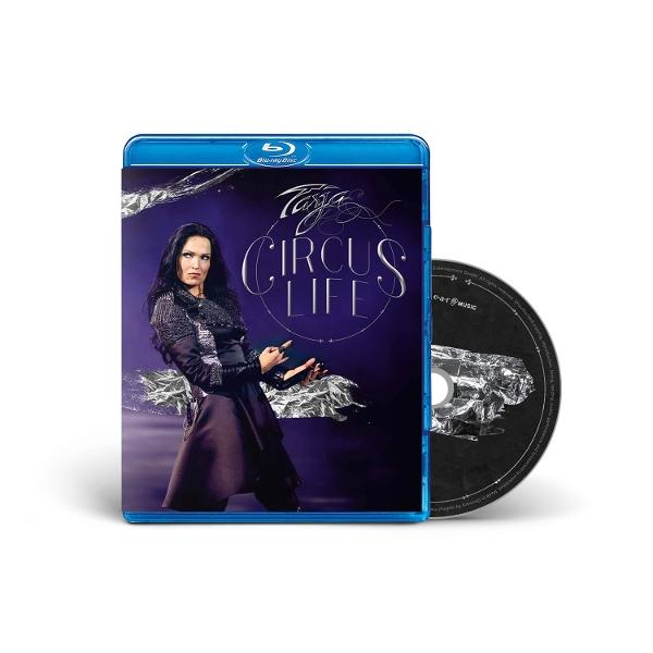 CD-Cover: Frau auf dem Cover, Titel 'Circus Life'. Blu-ray-Hülle mit Scheibe daneben. Weißer Hintergrund.