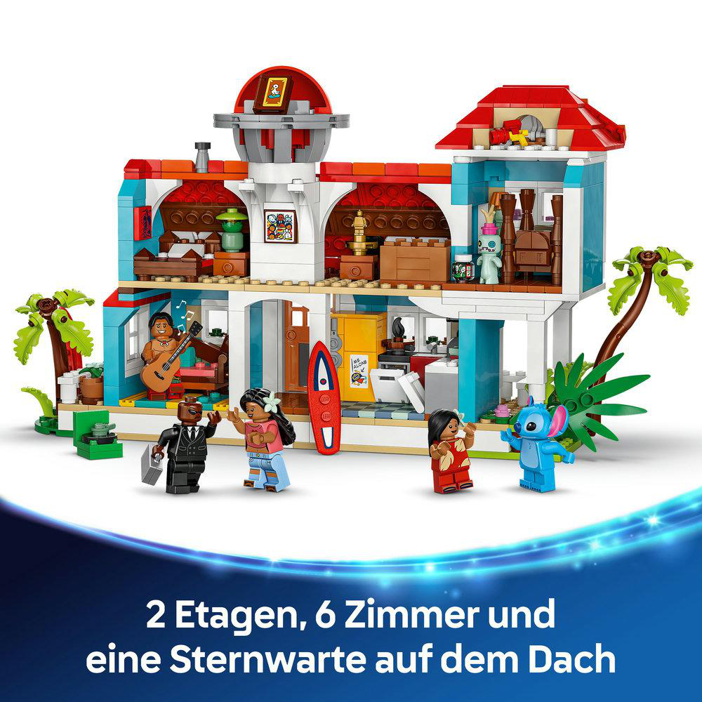 Ein Lego-Set mit einem zweistöckigen Gebäude, Figuren und einem roten Dach.