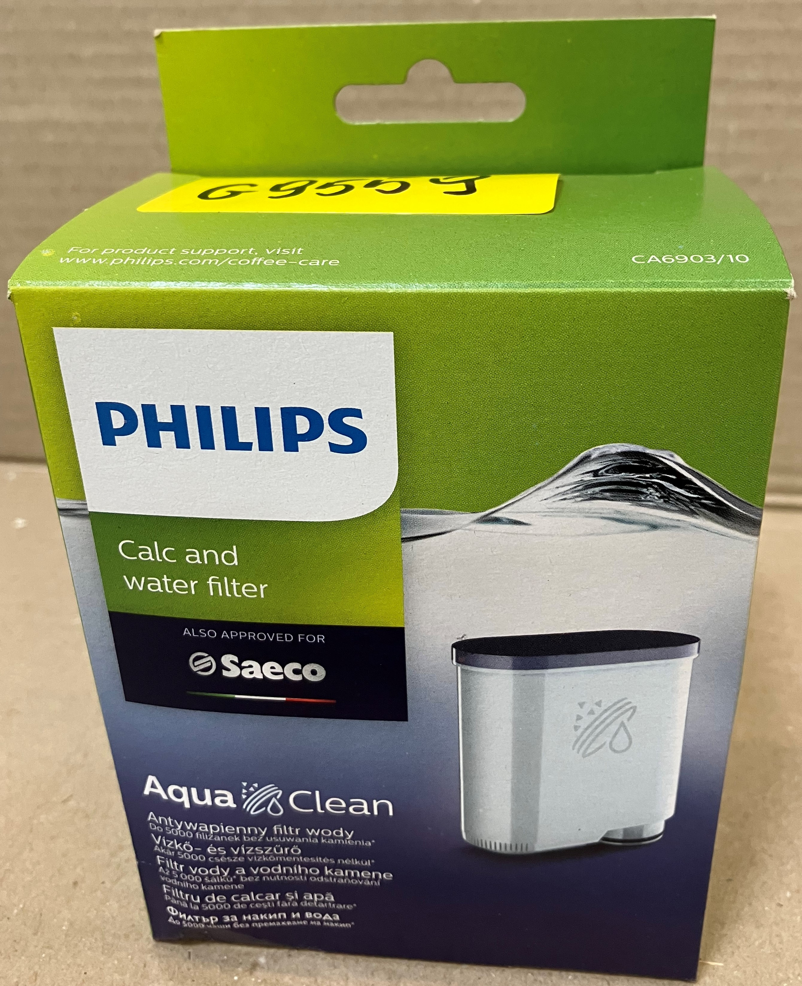 Pudełko filtra wody Philips AquaClean. Zielone z białym, niebieskim i czarnym designem. Tekst: Philips, Saeco.
