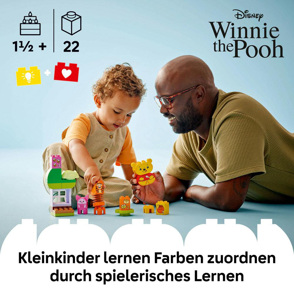 Vater und Kind spielen mit LEGO Winnie the Pooh und lernen Farben.