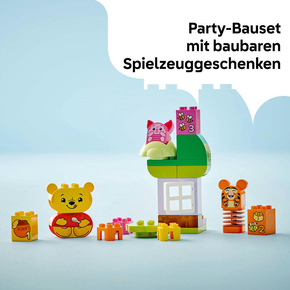 Lego Duplo Set mit Winnie Puuh Figuren und Bausteinen.