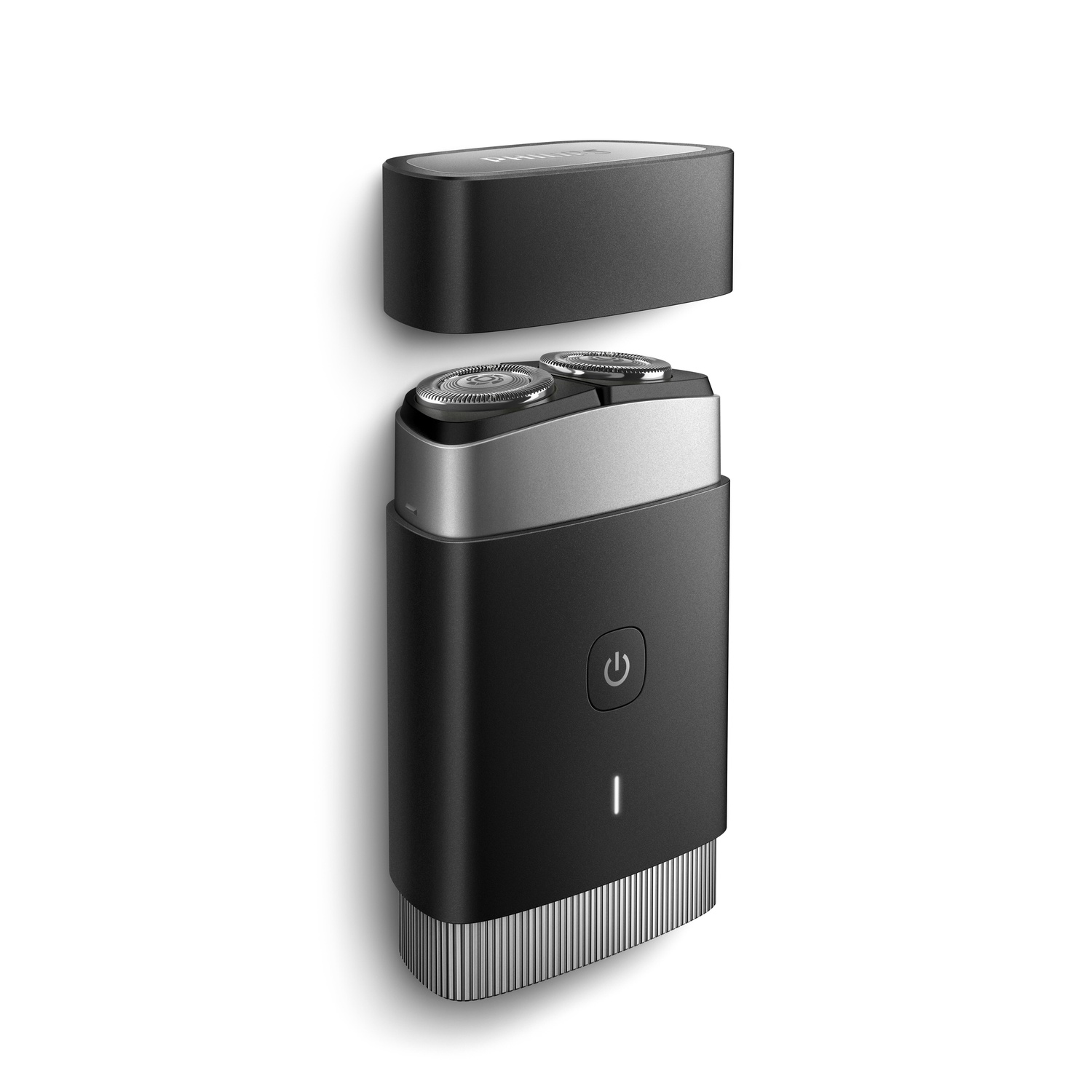 A black and silver electric shaver, with the top detached.
