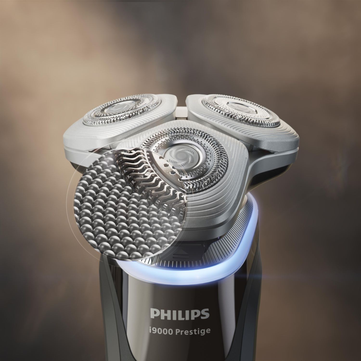 Gros plan d'un rasoir Philips i9000 Prestige. La tête de rasage et une section agrandie sont montrées.