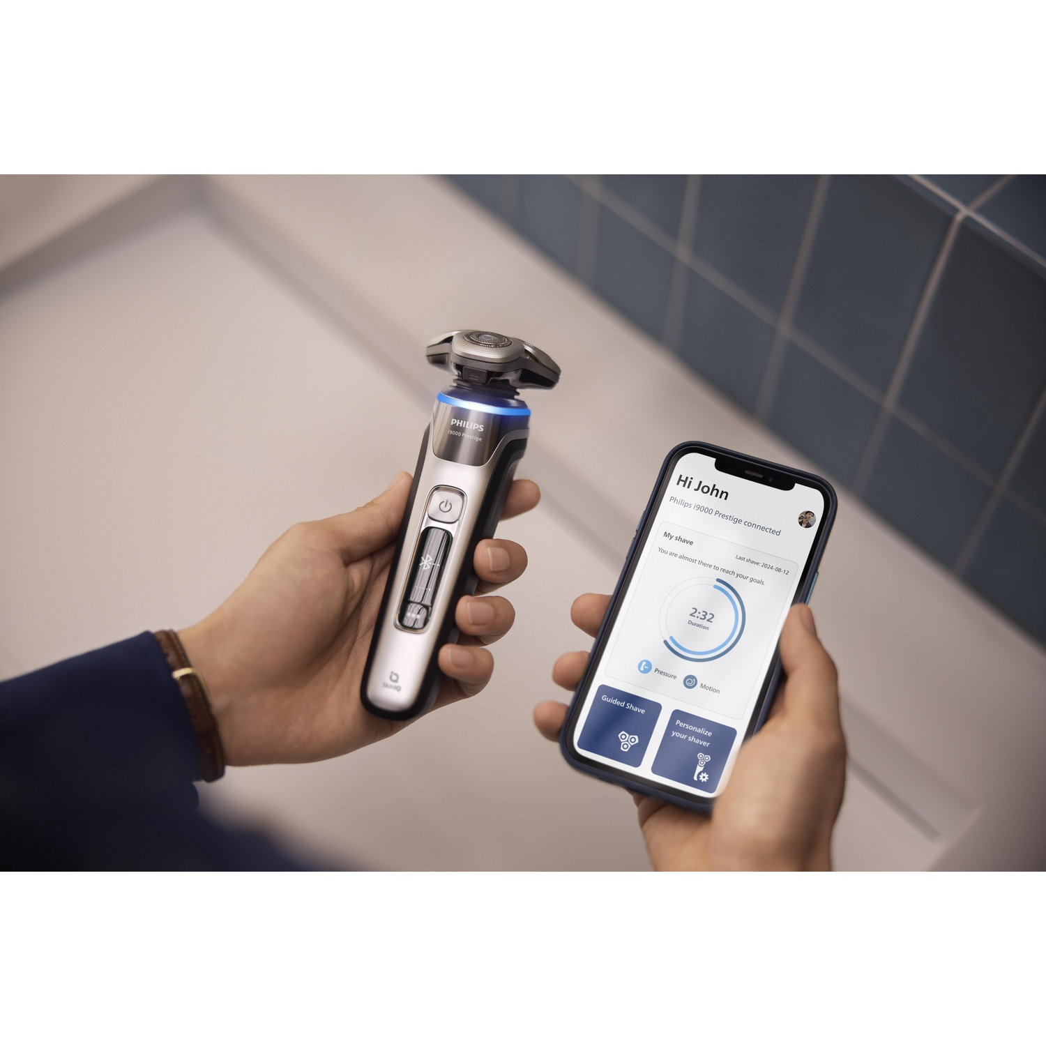 Man using electric shaver, connected to a phone showing shave details.