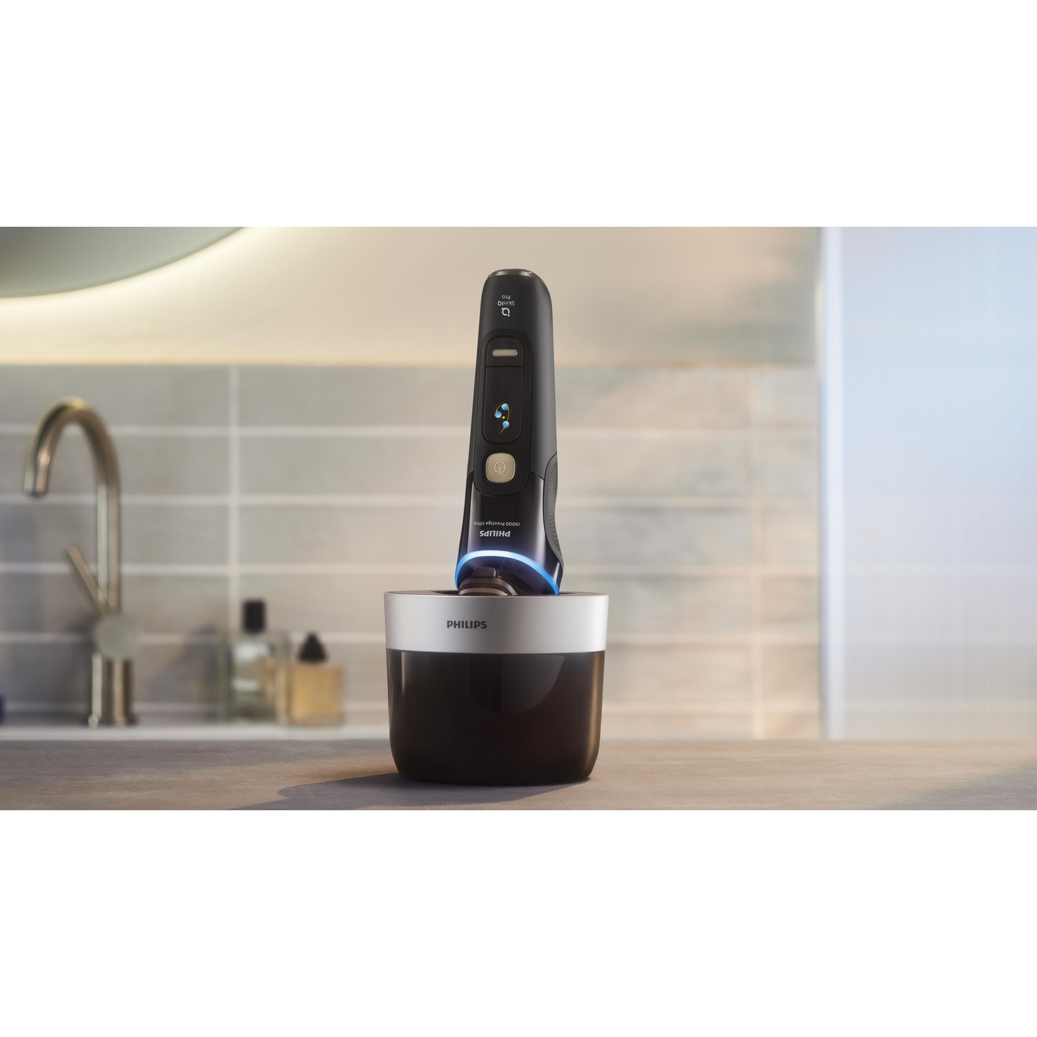 Black electric shaver in a charging base, on a countertop, with a tiled background.
