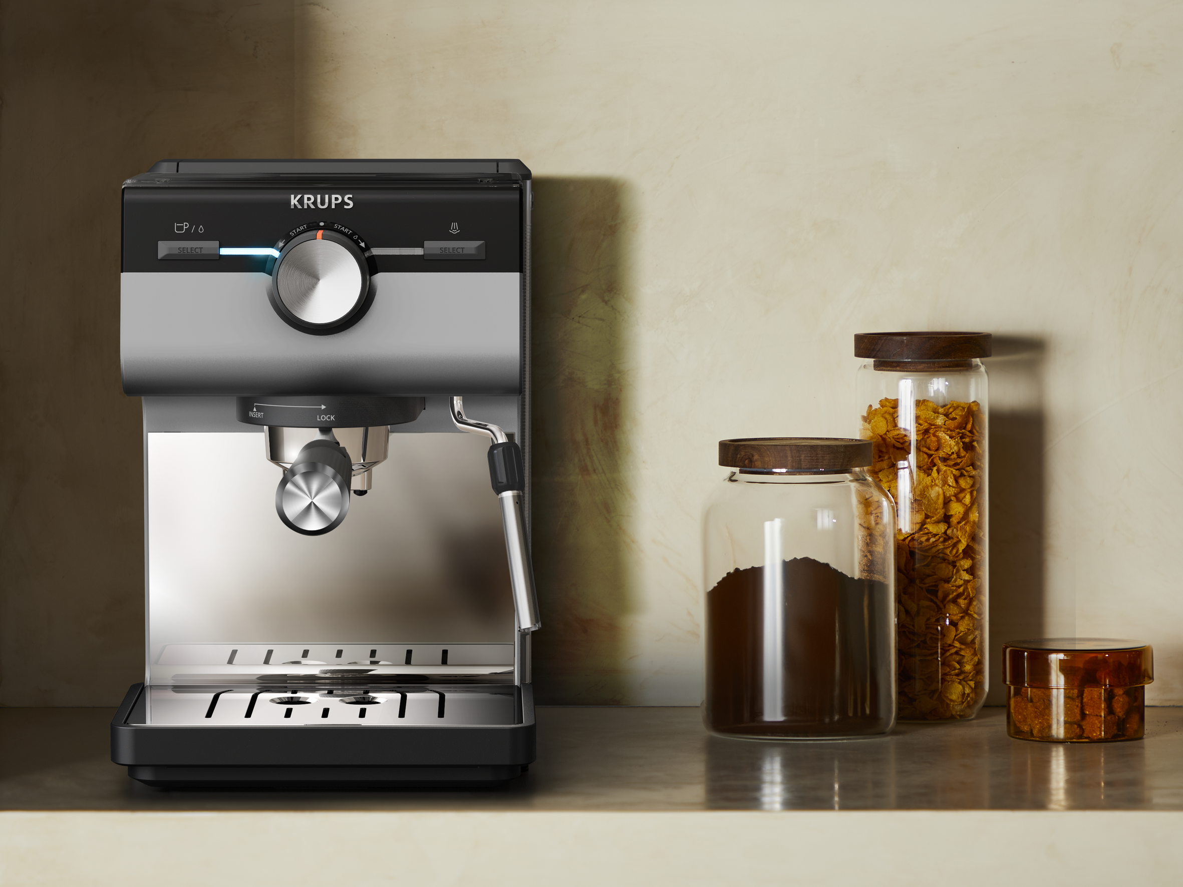 Ekspres do kawy z akcesoriami. Czarno-srebrny design, słoiki z kawą i ziarnami, na powierzchni.