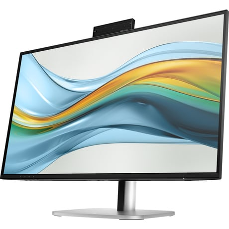 Un monitor negro con base plateada muestra un fondo de pantalla abstracto con olas azules, verdes y naranjas.