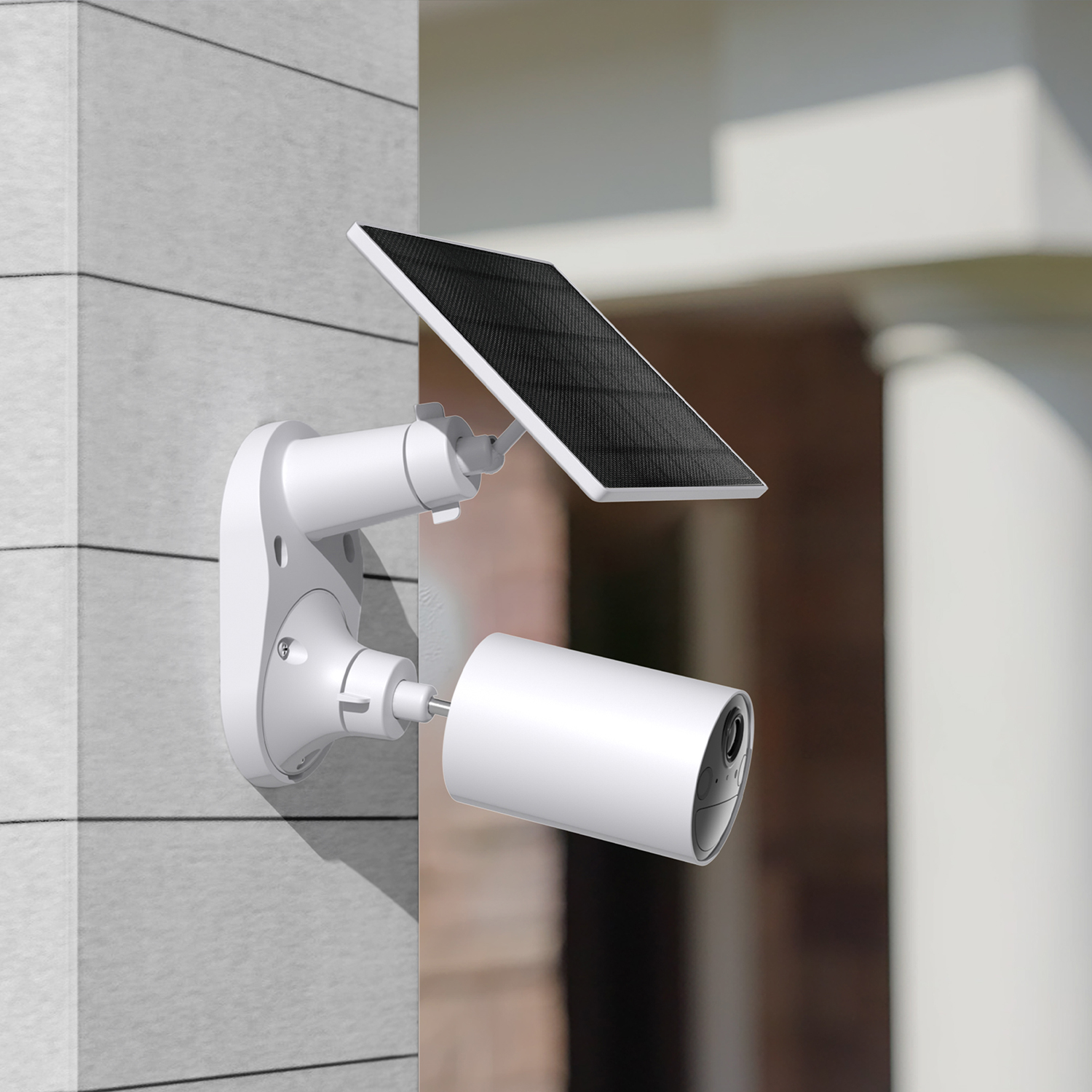 Una telecamera di sicurezza bianca a energia solare montata su un muro.