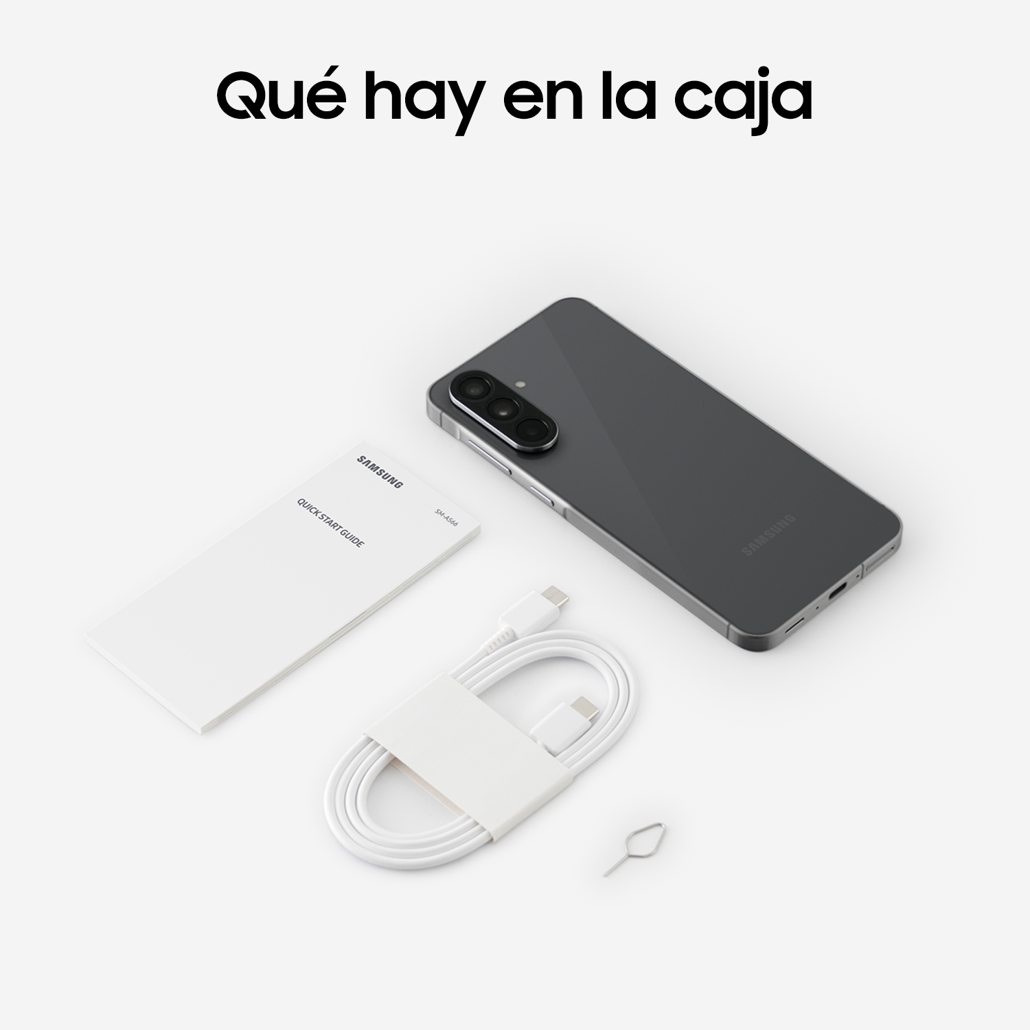 El contenido de la caja de un teléfono Samsung, incluido el teléfono, un cable, una herramienta SIM y una guía de inicio rápido en blanco.