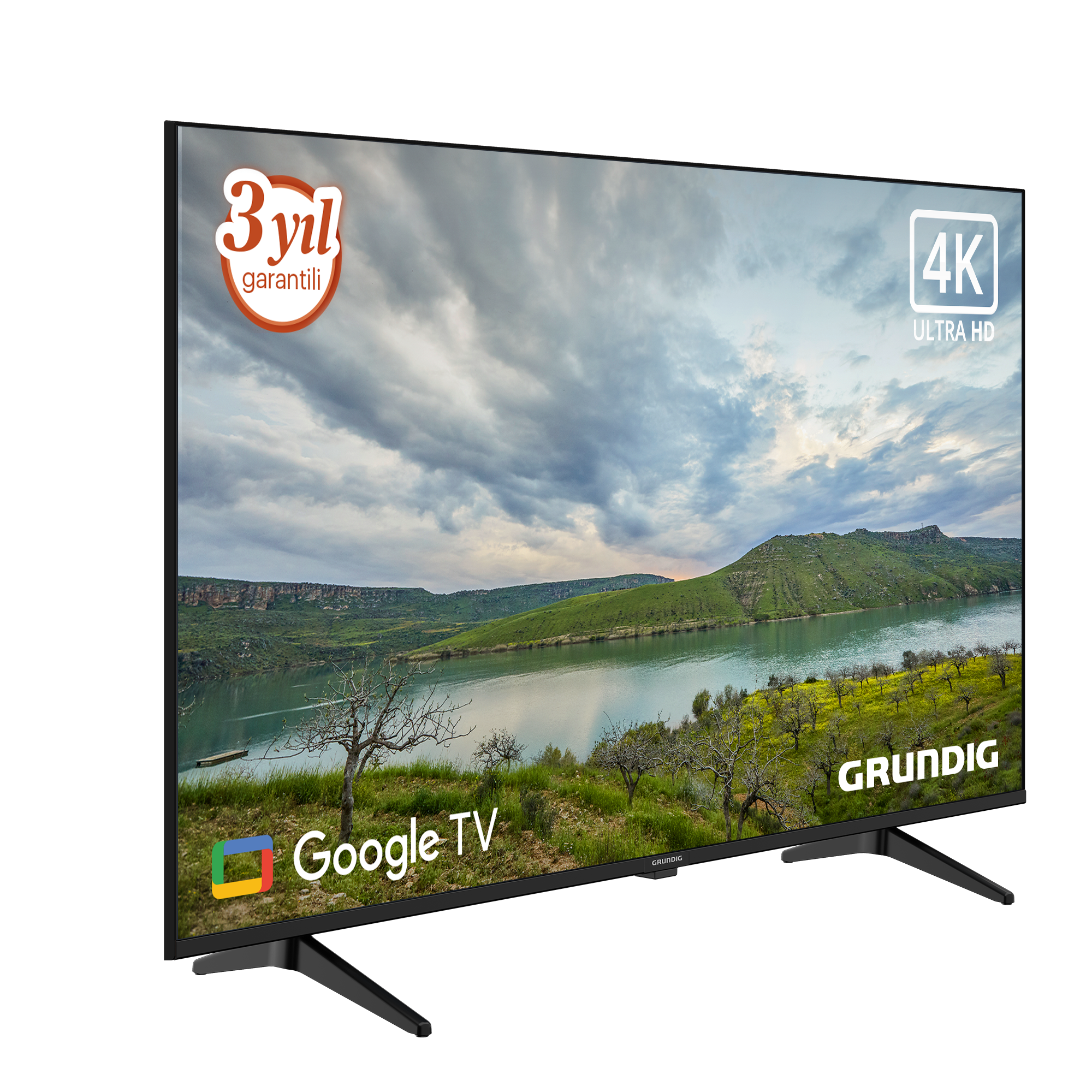 Bir Grundig TV, bir manzara görüntüsü görüntüler. Google TV logosunu ve 3 yıllık garantiyi içerir.
