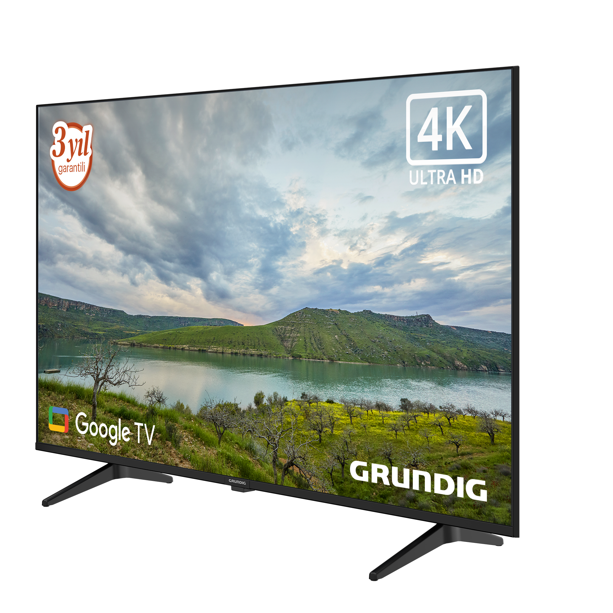 Siyah bir Grundig 4K Ultra HD TV, bulutlu bir gökyüzü ile manzaralı bir manzara sergiliyor.