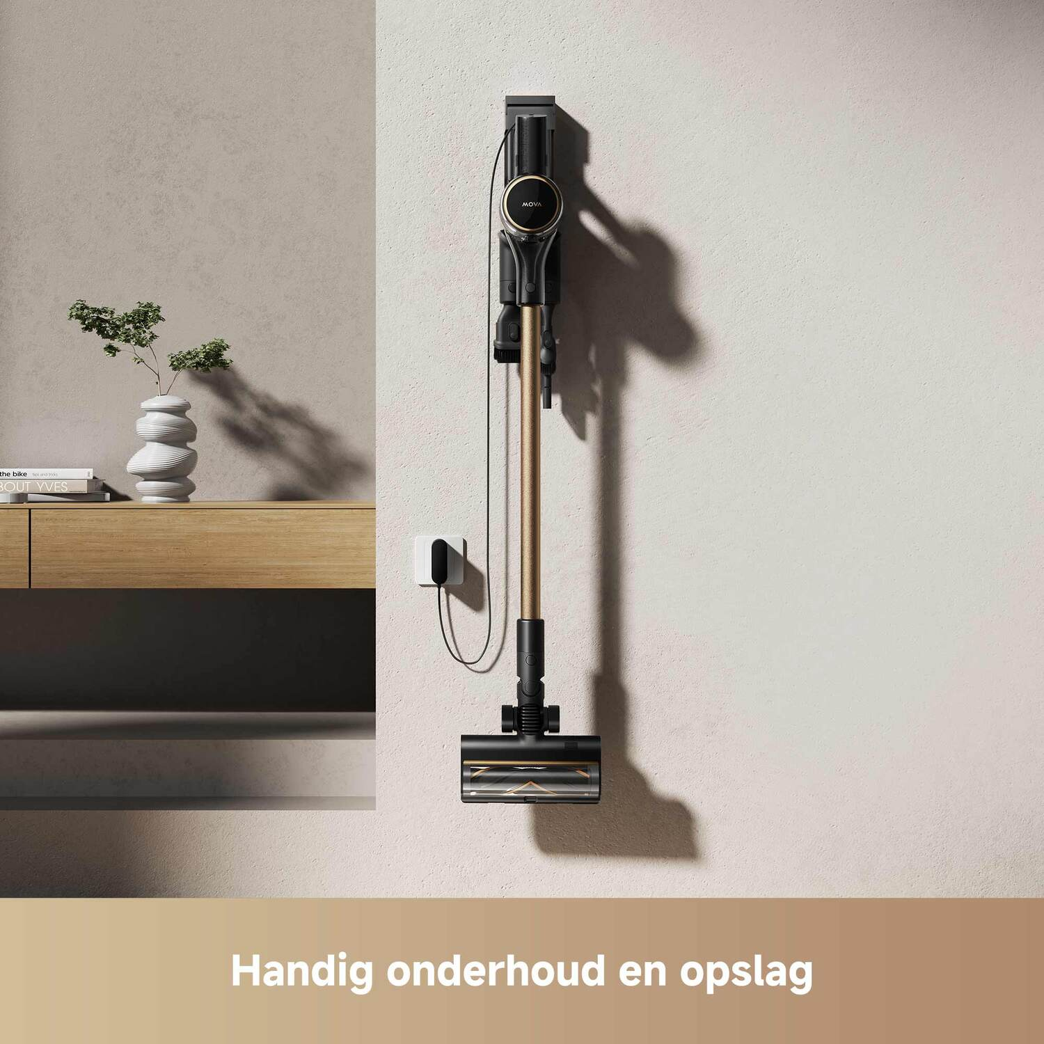 A vacuum cleaner on a wall mount with a power cable.