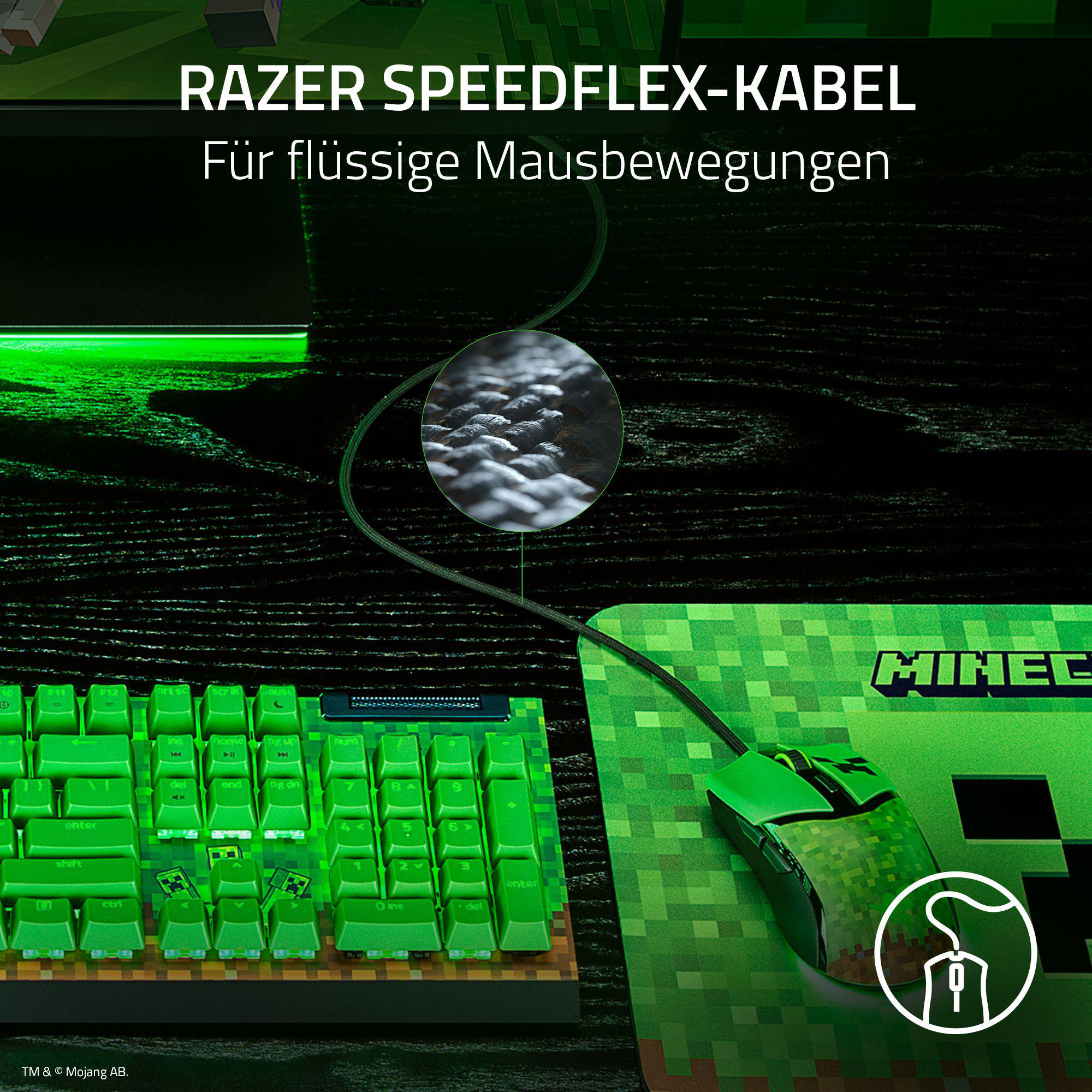 Grüne Tastatur und Maus auf einem Schreibtisch. Die Tastatur hat grüne Tastenkappen, die Maus ein Logo.