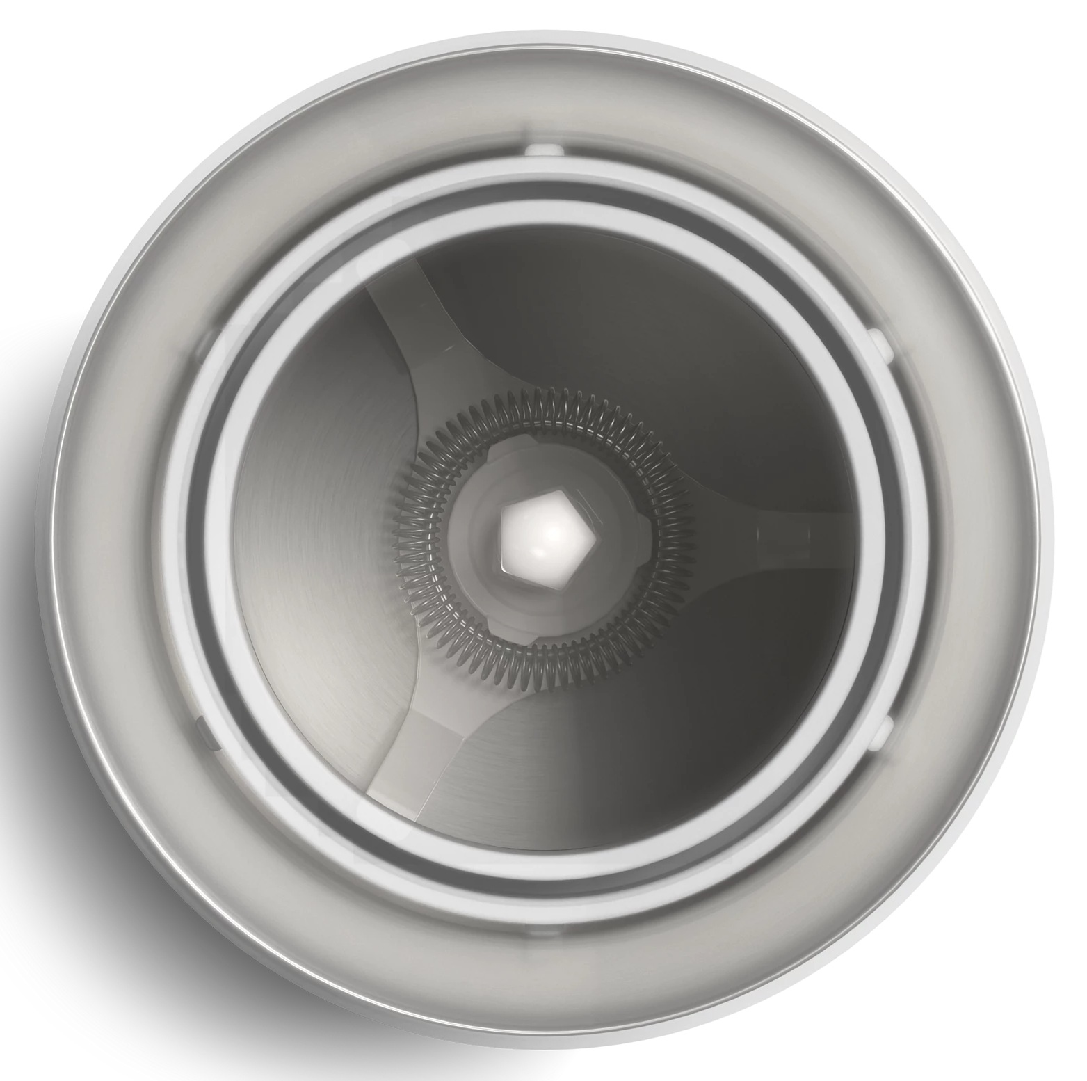 Widok z góry na wnętrze białego urządzenia.