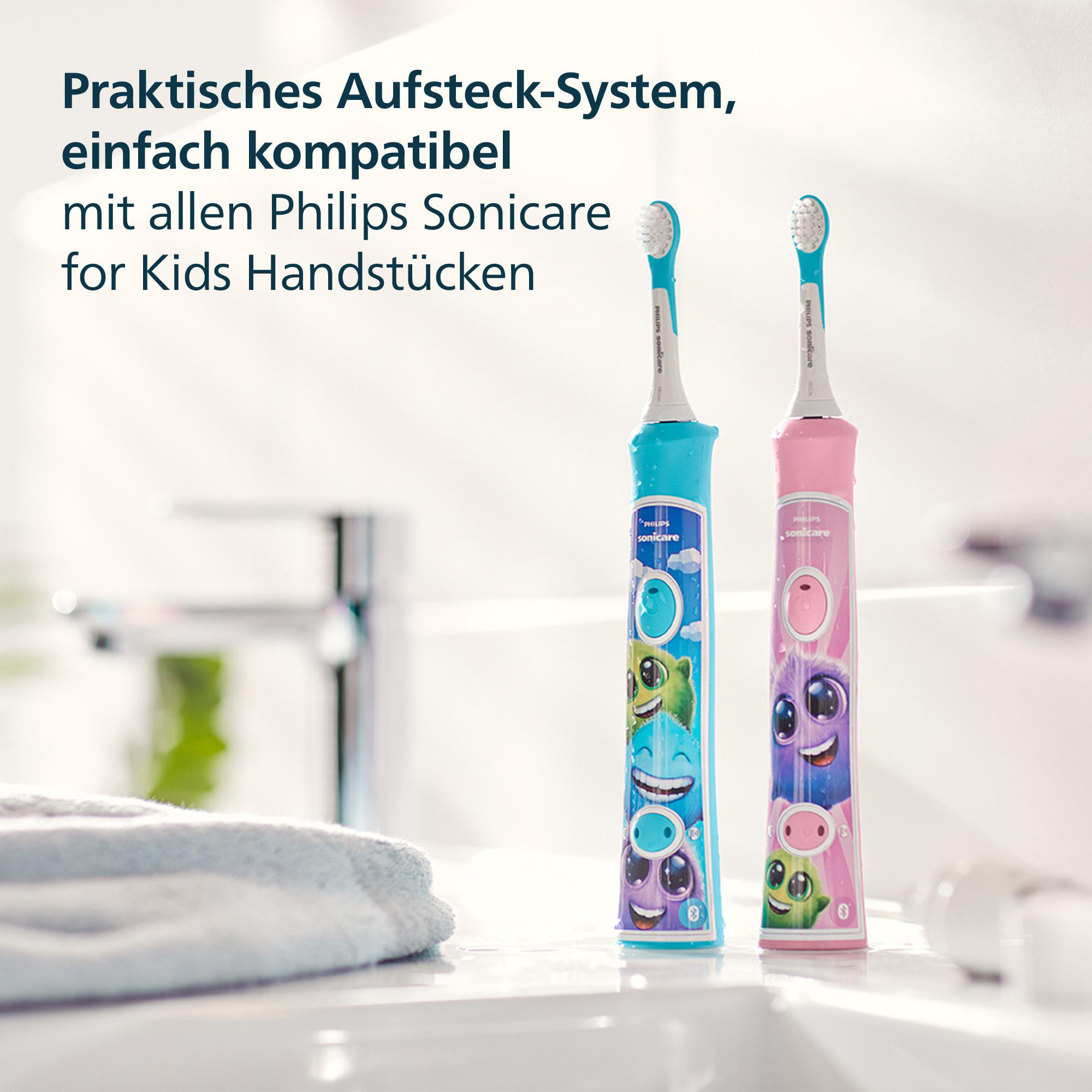 Zwei bunte Zahnbürsten mit Zeichentrickfiguren. Eine ist blau, die andere rosa.