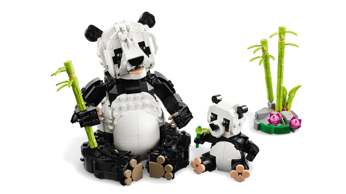 Model samochodu wyścigowego Lego z figurką Lego skaczącą nad nim.