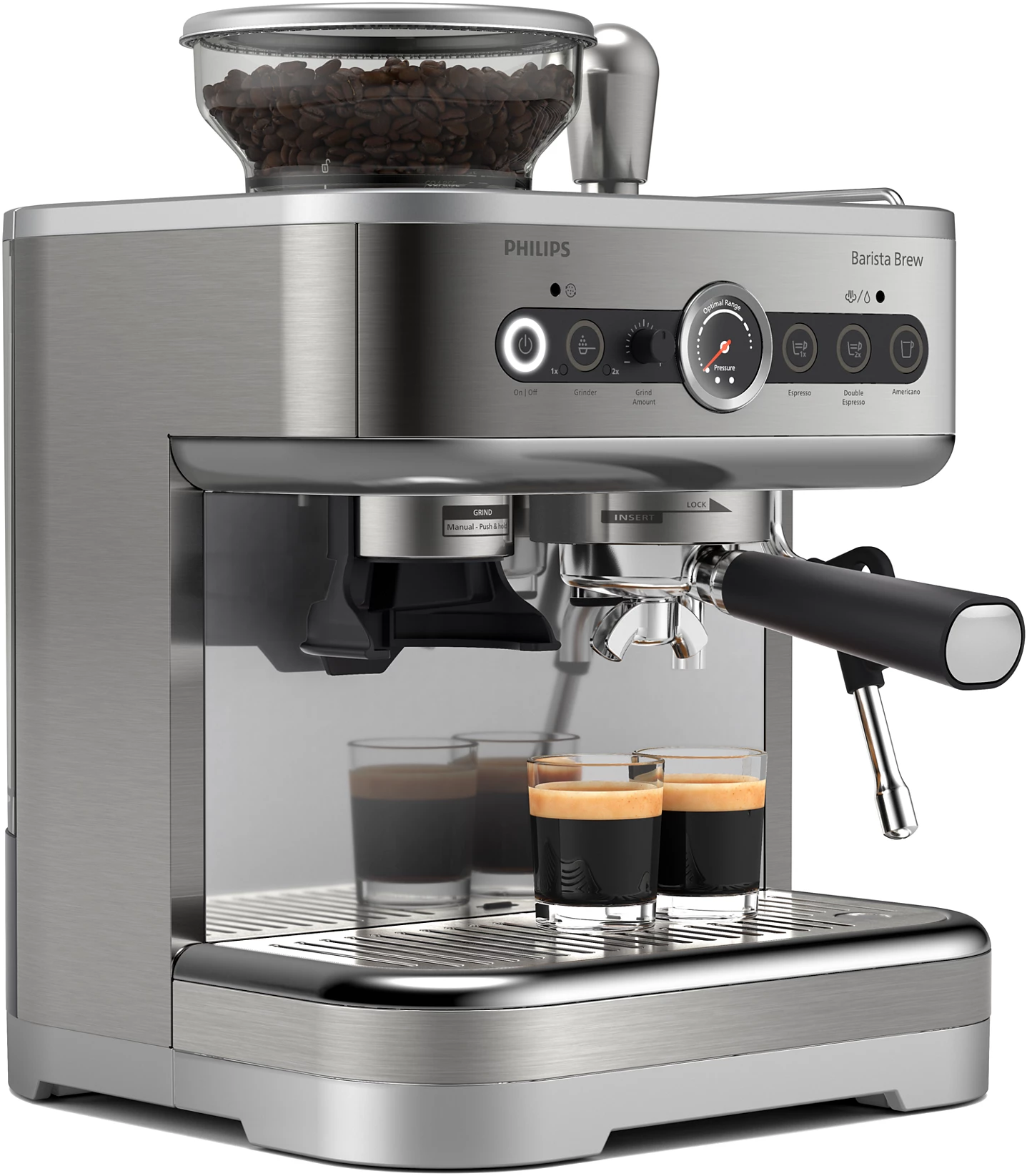 Machine à expresso argentée avec grains de café sur le dessus, deux verres à expresso.