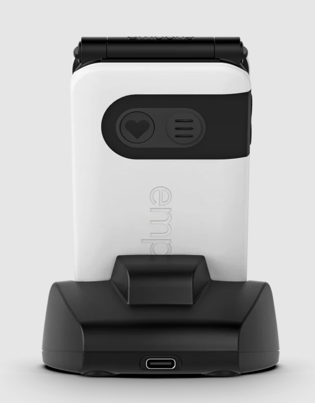 Weißes und schwarzes Gerät auf einem Ständer. Es hat eine Herz- und Menütaste sowie einen USB-Anschluss.