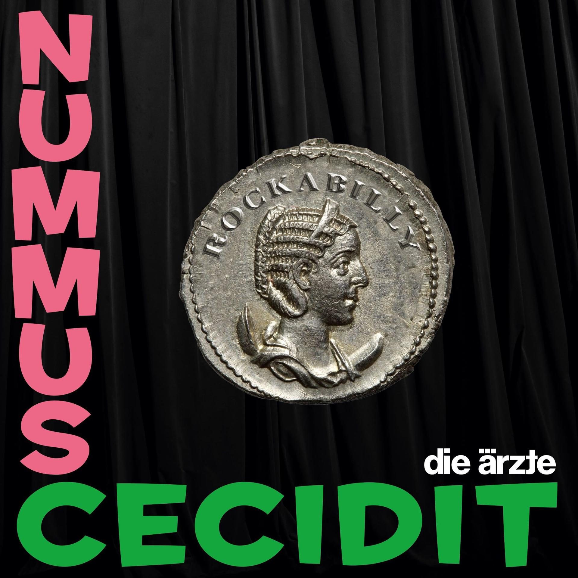 Eine silberne Münze mit Profil, die Worte "ROCKABILLY" und "CECEDIT" in Grün auf schwarzem Hintergrund.