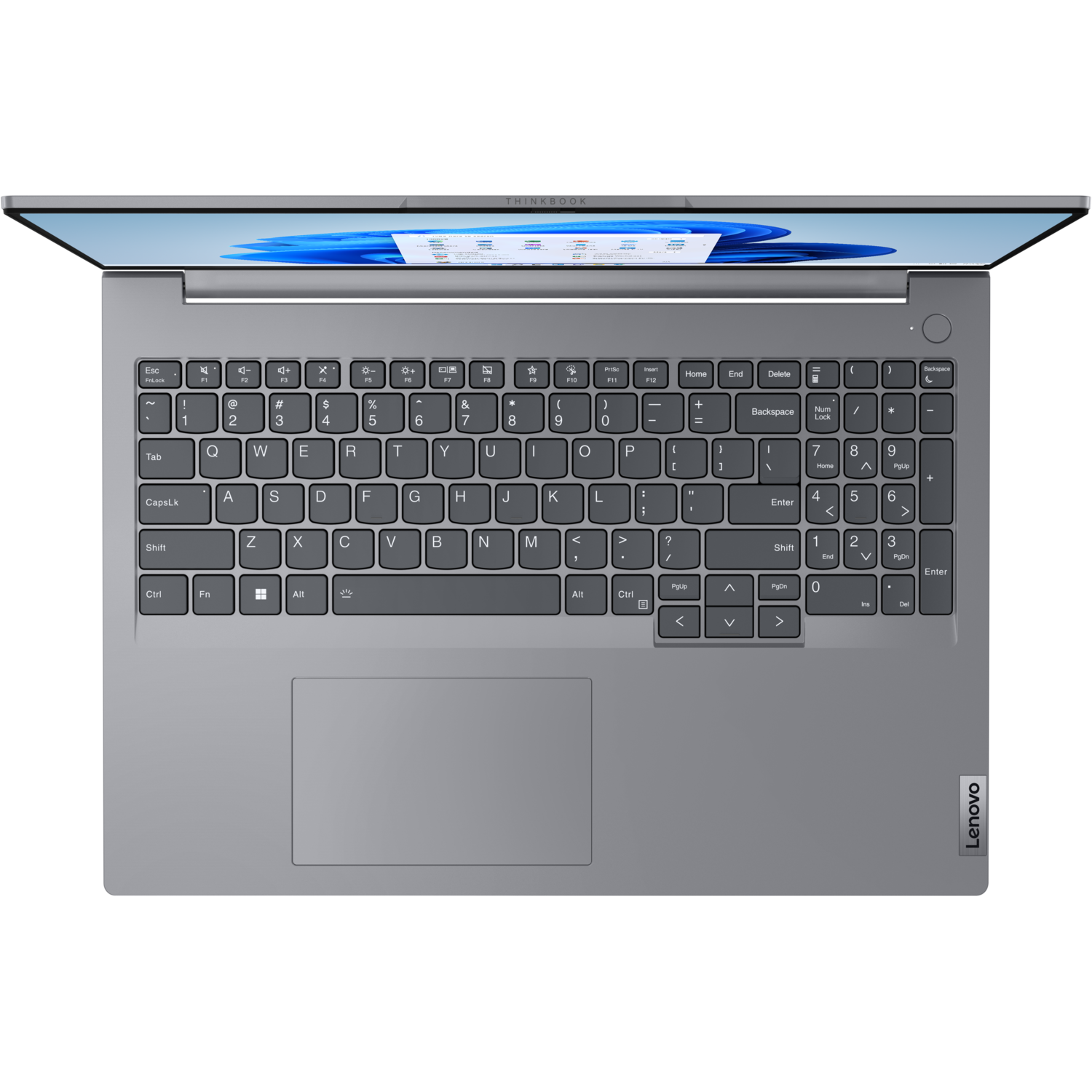 Een grijze laptop, bovenaanzicht, toetsenbord zichtbaar, open op een zwarte achtergrond.