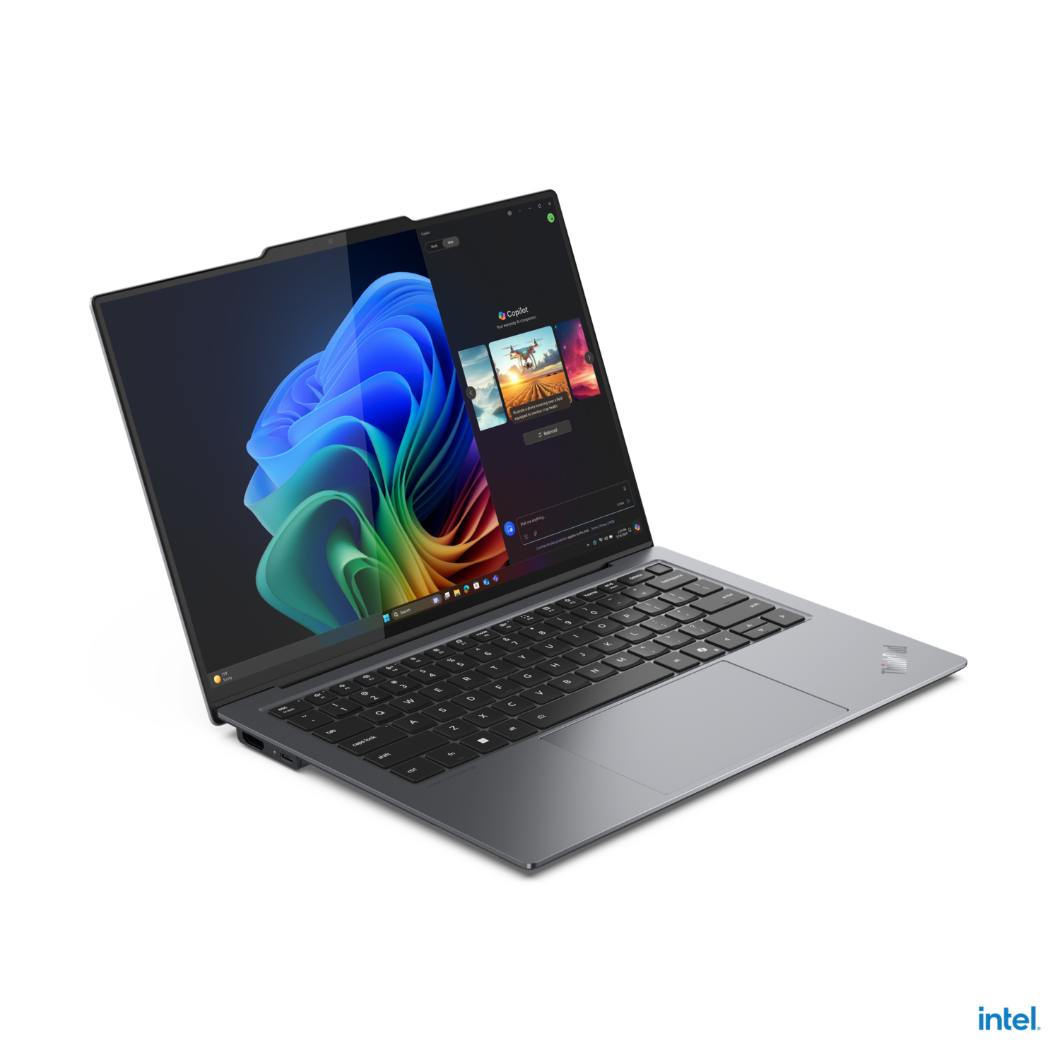 Laptop, open. Screen displaying a software interface. The laptop is on a black surface.