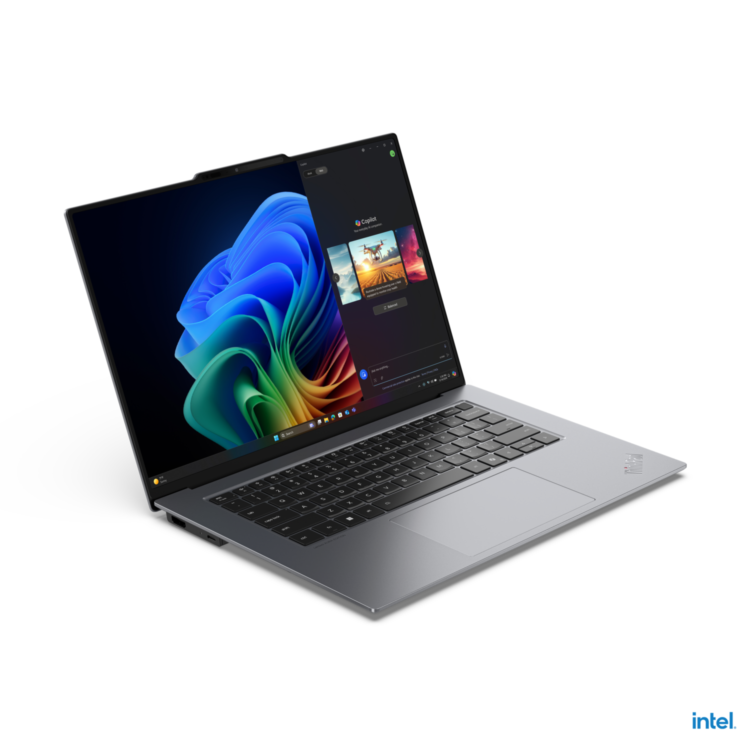 A laptop displays a screen with a vibrant desktop. Intel logo is at the bottom. The background is black.