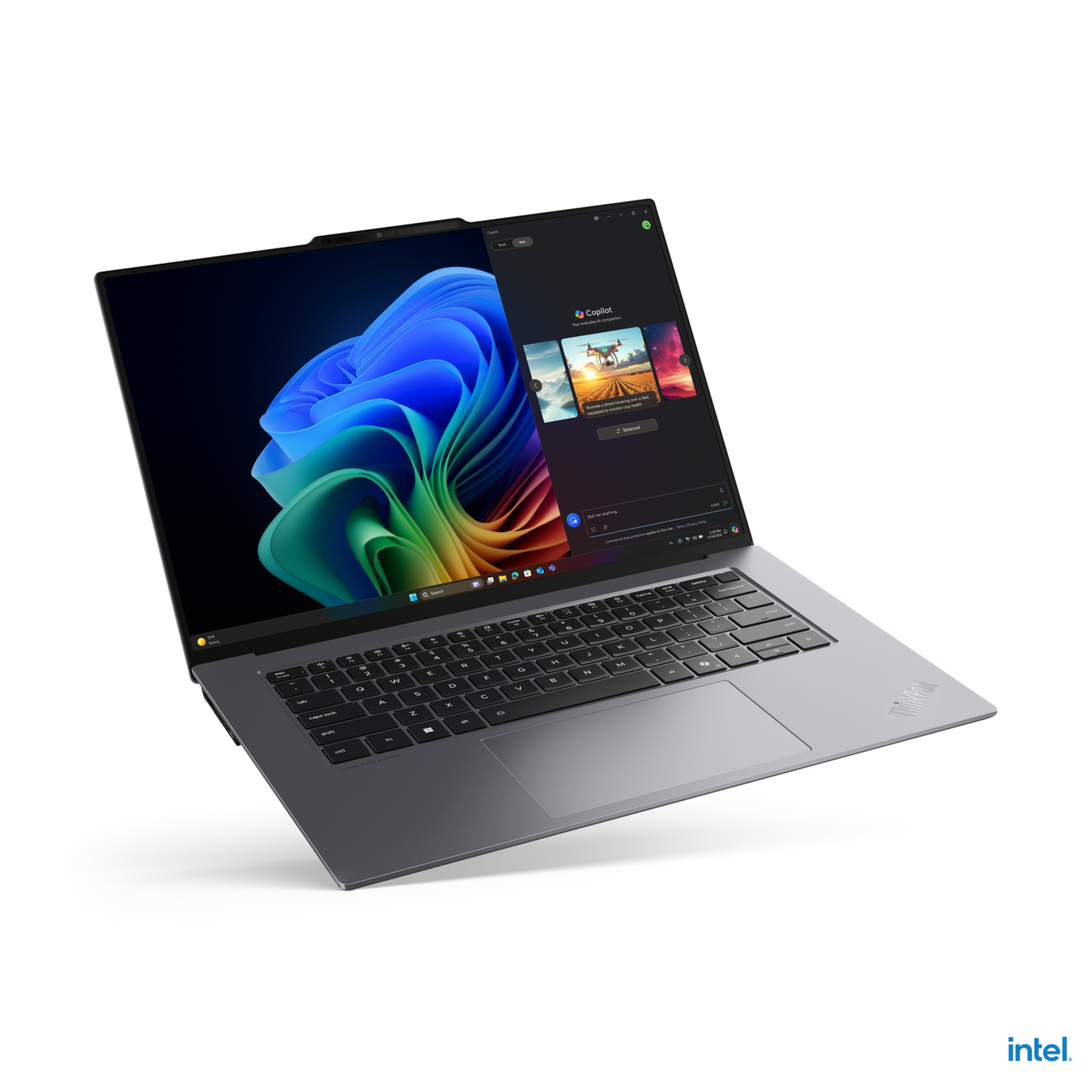 Laptop on black surface, display showing a copilot interface.
