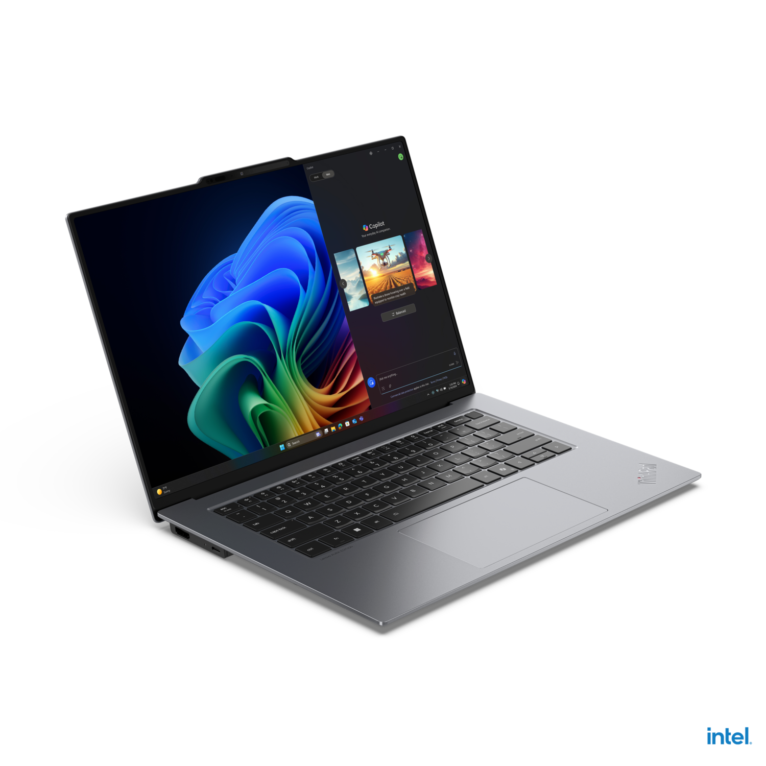 Laptop with a display showing a colorful interface. The laptop has a silver body and black keyboard.